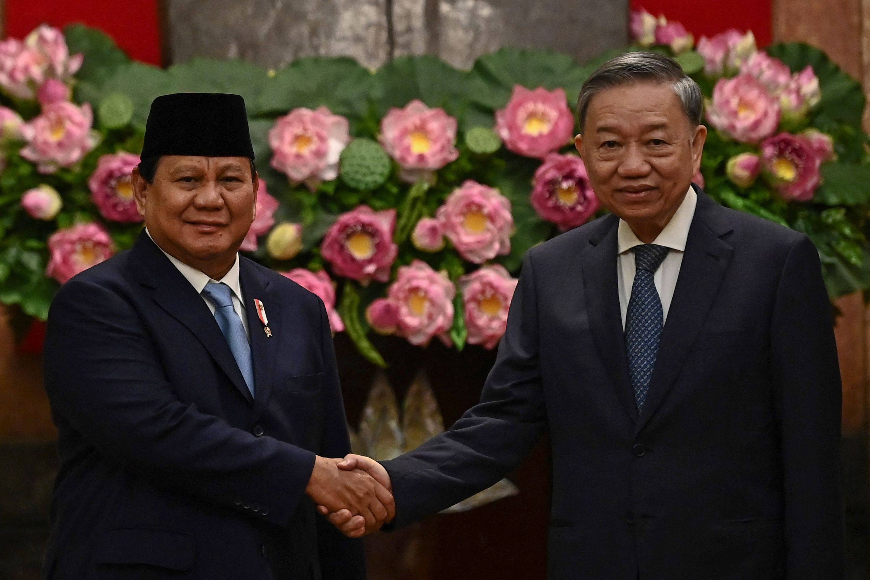 Vietnam’s President To Lam (right) shakes hands with Indonesia’s Defence Minister and president-elect Prabowo Subianto during their meeting at the Presidential Palace in Hanoi on September 13. Photo: AFP