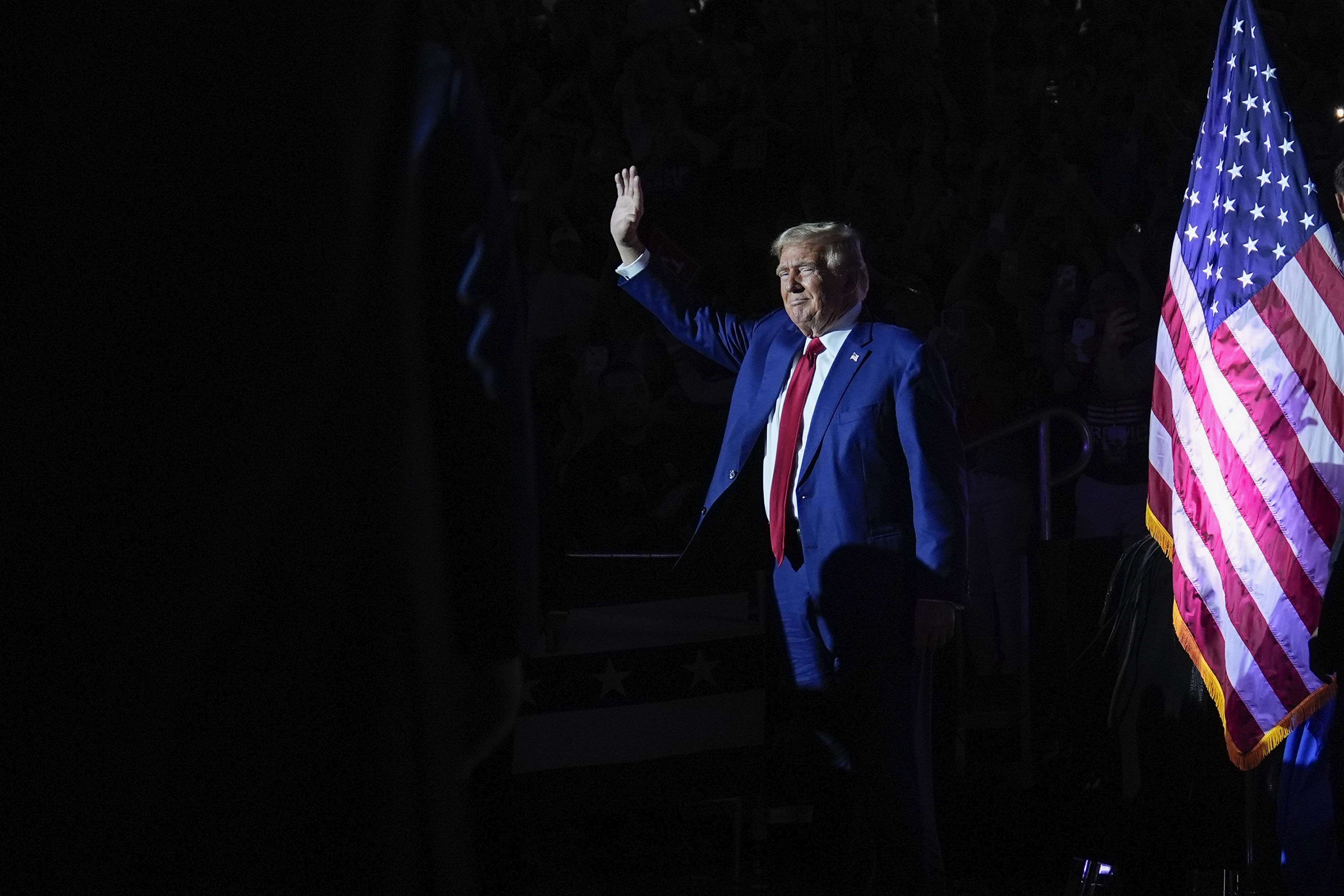 Donald Trump waves to supporters at a town hall event in Flint, Michigan. Photo: AP 