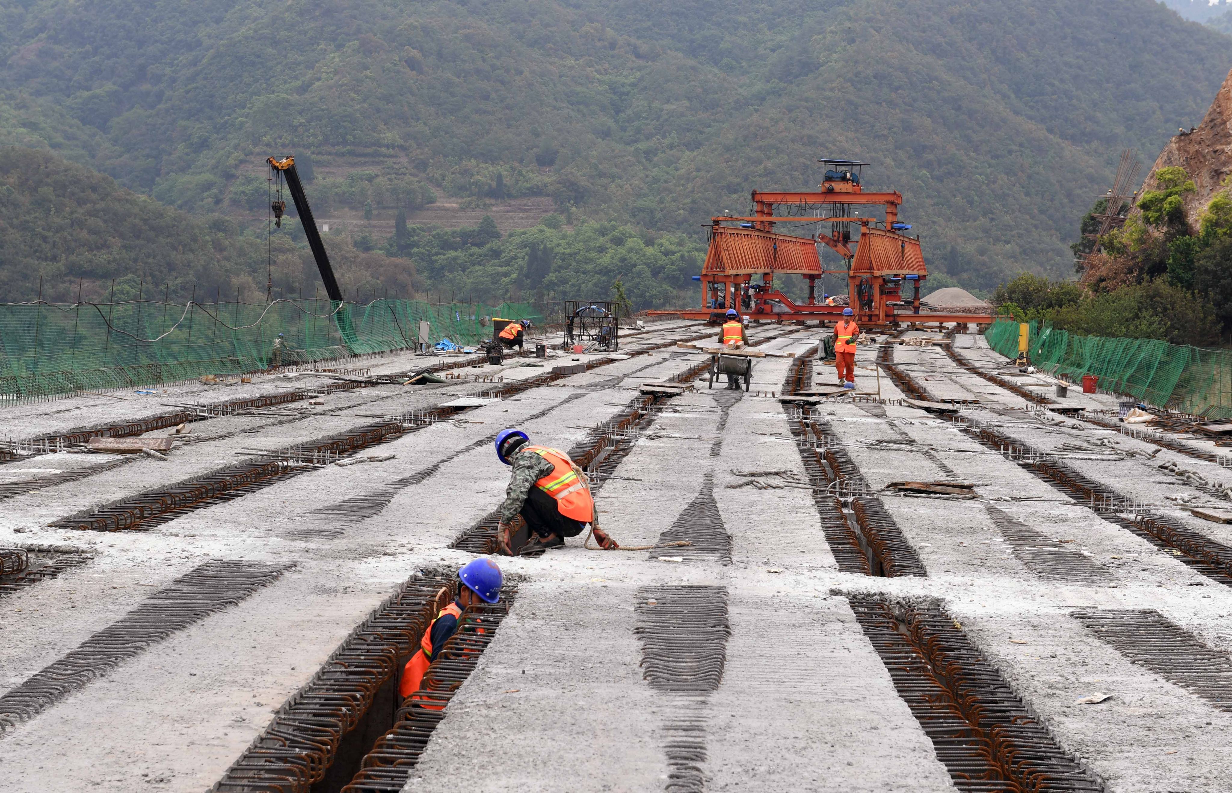 A construction crew works on an expressway in China’s Yunnan province, which has launched a 100-day campaign to boost economic growth. Photo: Xinhua