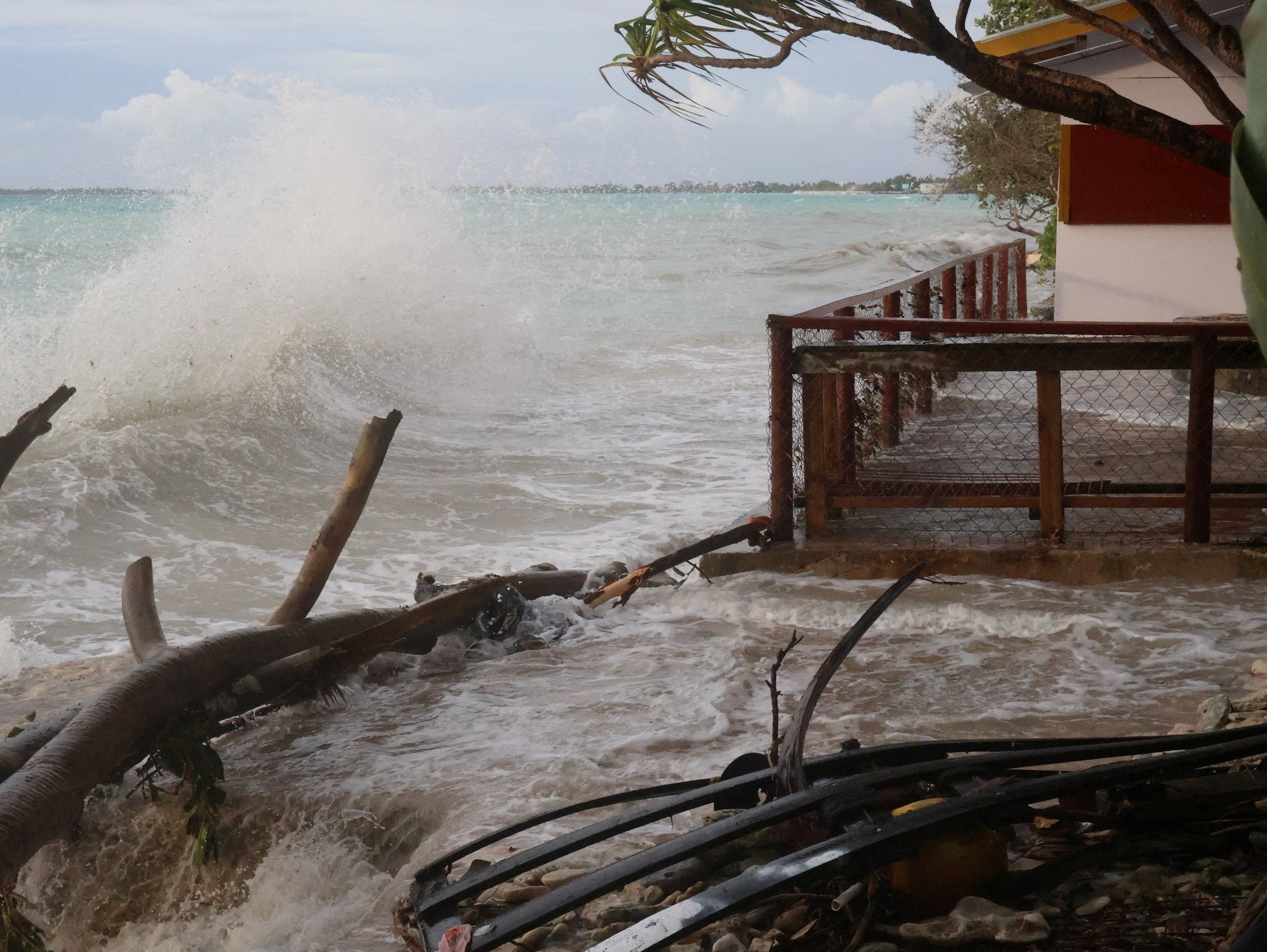 High tides crash ashore in Funafuti, Tuvalu, on February 11. Tuvalu and other low-lying Pacific Island nations face a growing threat of inundation as climate change drives rising sea levels and more intense natural disasters. Photo: Tuvalu Meteorological Service / Reuters