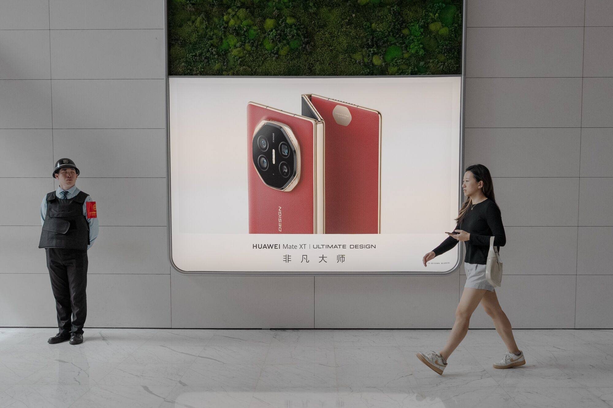 An advertisement for Huawei Technologies’ Mate XT tri-fold smartphone outside the company’s store in Beijing’s Wangfujing shopping area on September 13, 2024. Photo: Bloomberg