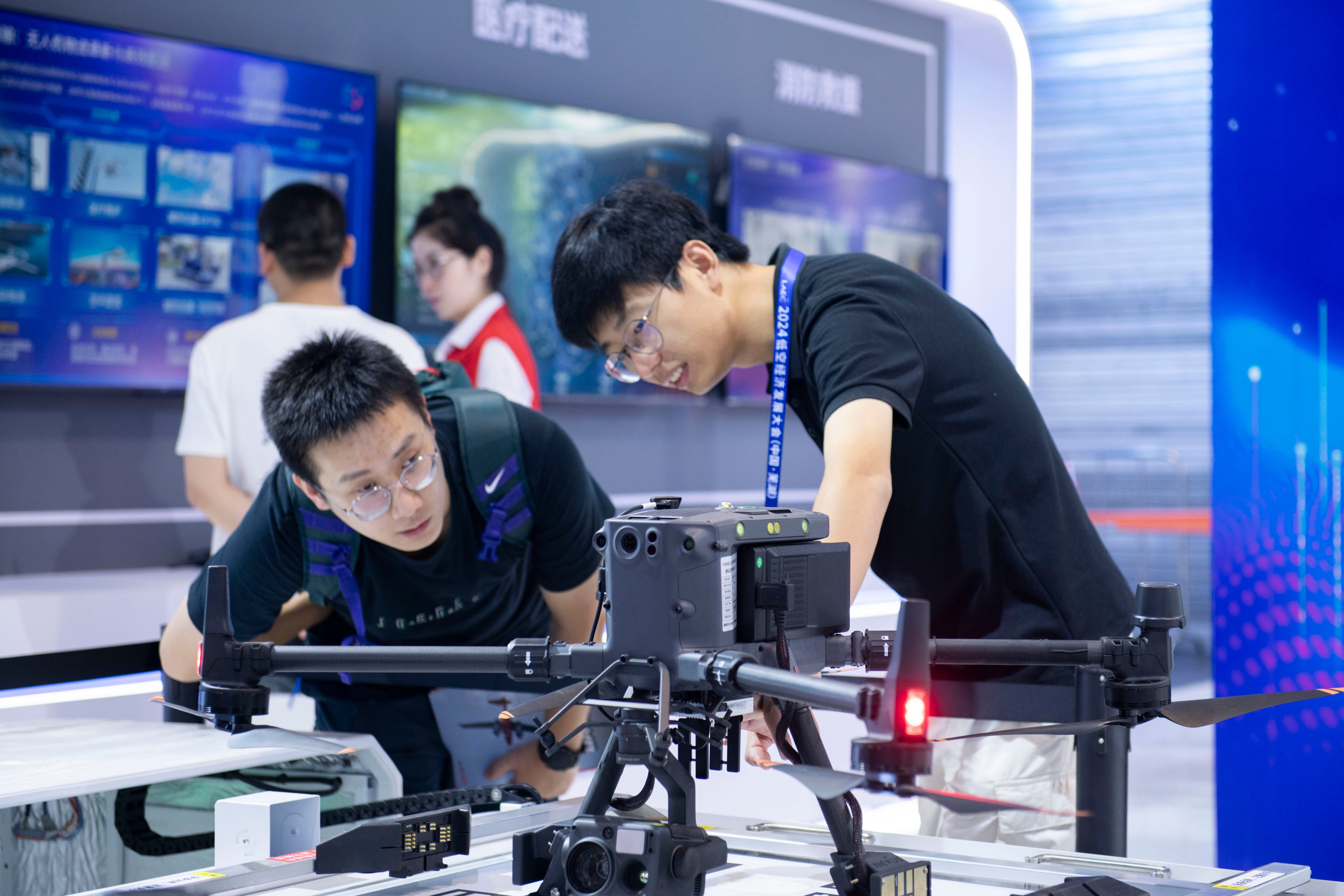 A visitor learns about an inspection drone at an exhibition of the 2024 Low Altitude Economic Development Conference in Wuhu, east China’s Anhui province. Photo: Xinhua