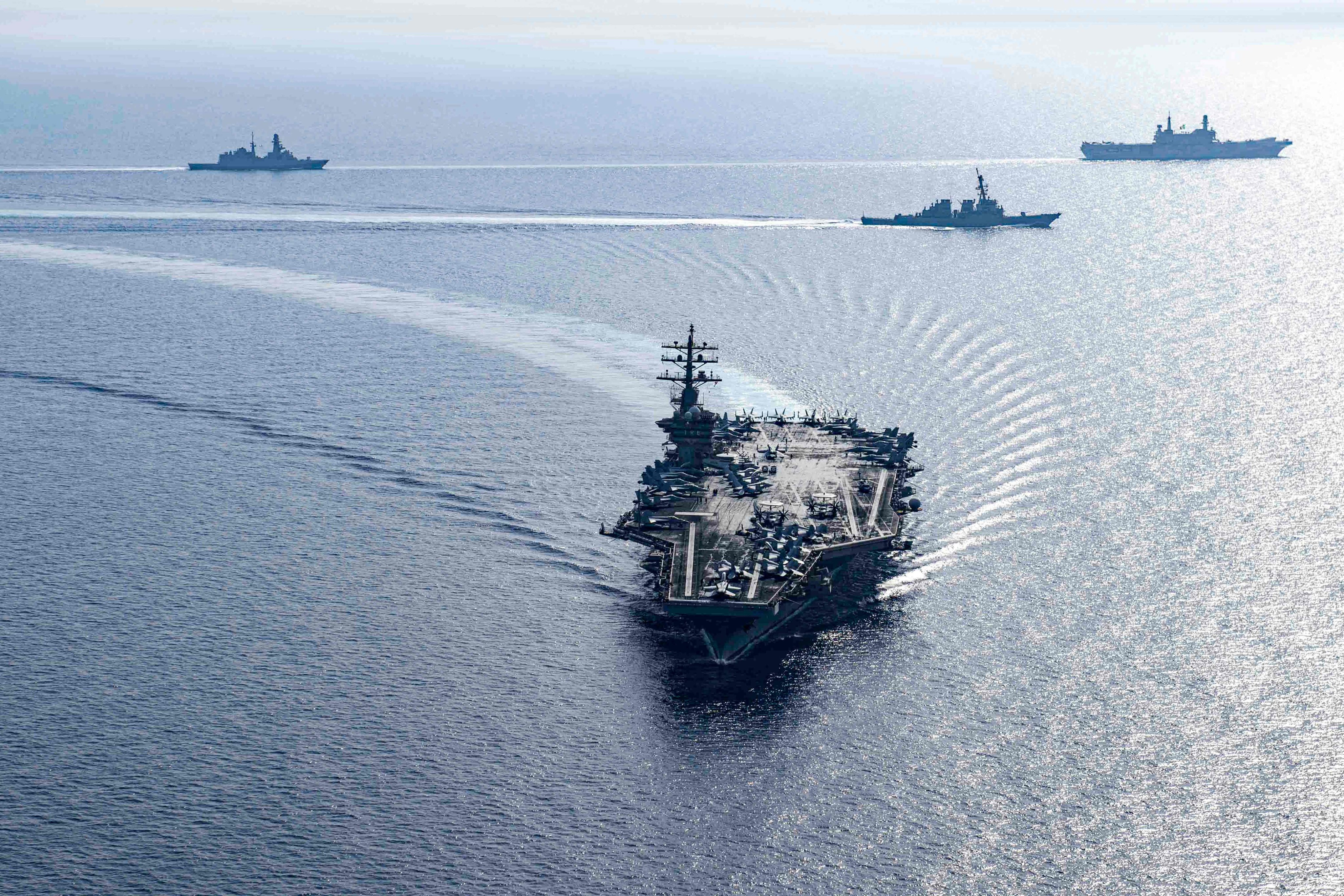 The US Navy aircraft carrier USS Dwight D. Eisenhower and two guided-missile destroyers sail in formation in the Red Sea with the Italian aircraft carrier ITS Cavour in June. Photo: US Navy via AFP 