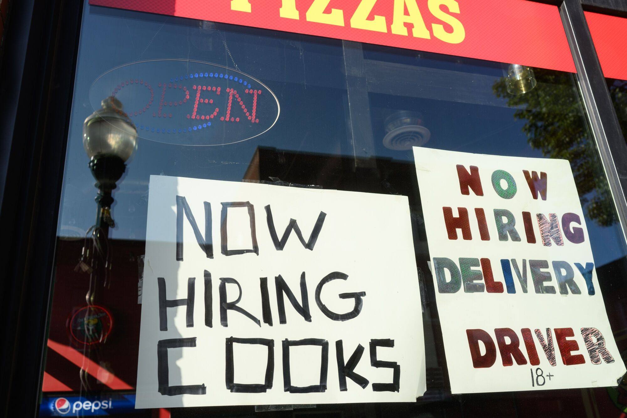 “Help Wanted” signs are posted outside a restaurant in Mount Pleasant, Pennsylvania. US employment increased less than expected in August. Photo: Bloomberg