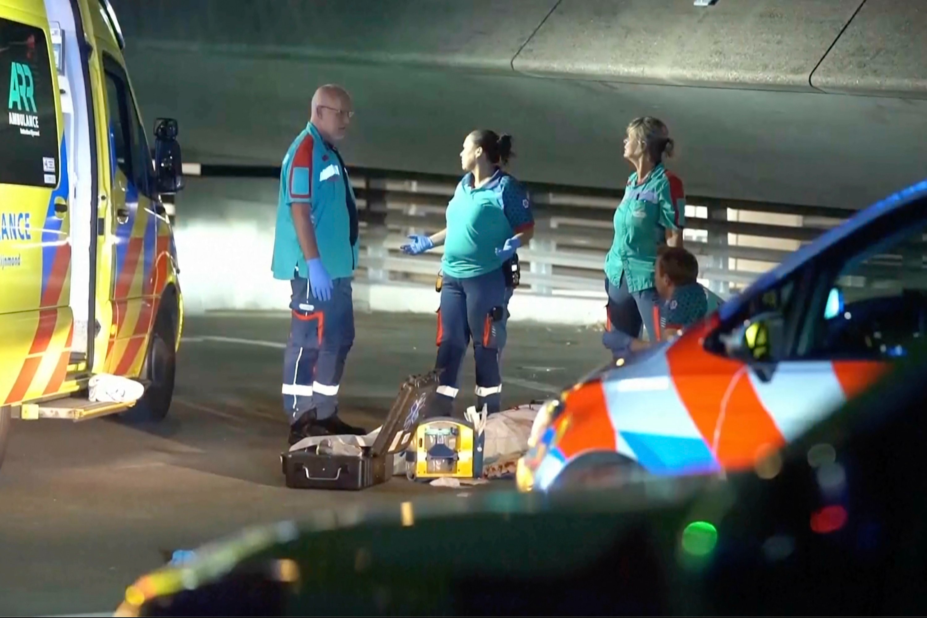 Emergency personnel respond to a stabbing incident in Rotterdam late on Thursday. Photo: Media TV via AP