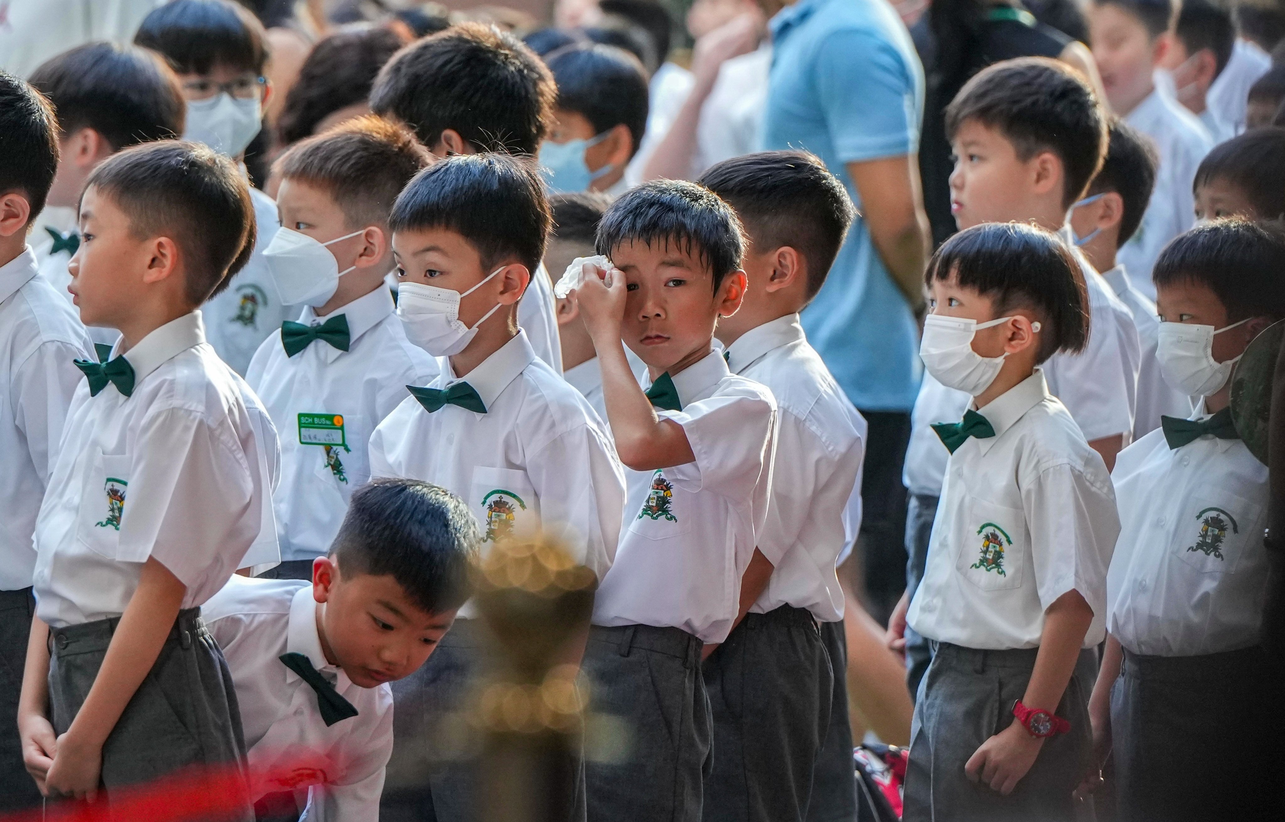 Students return to school on the first day of the academic year at St Joseph’s Primary School in Wan Chai. Photo: Sam Tsang