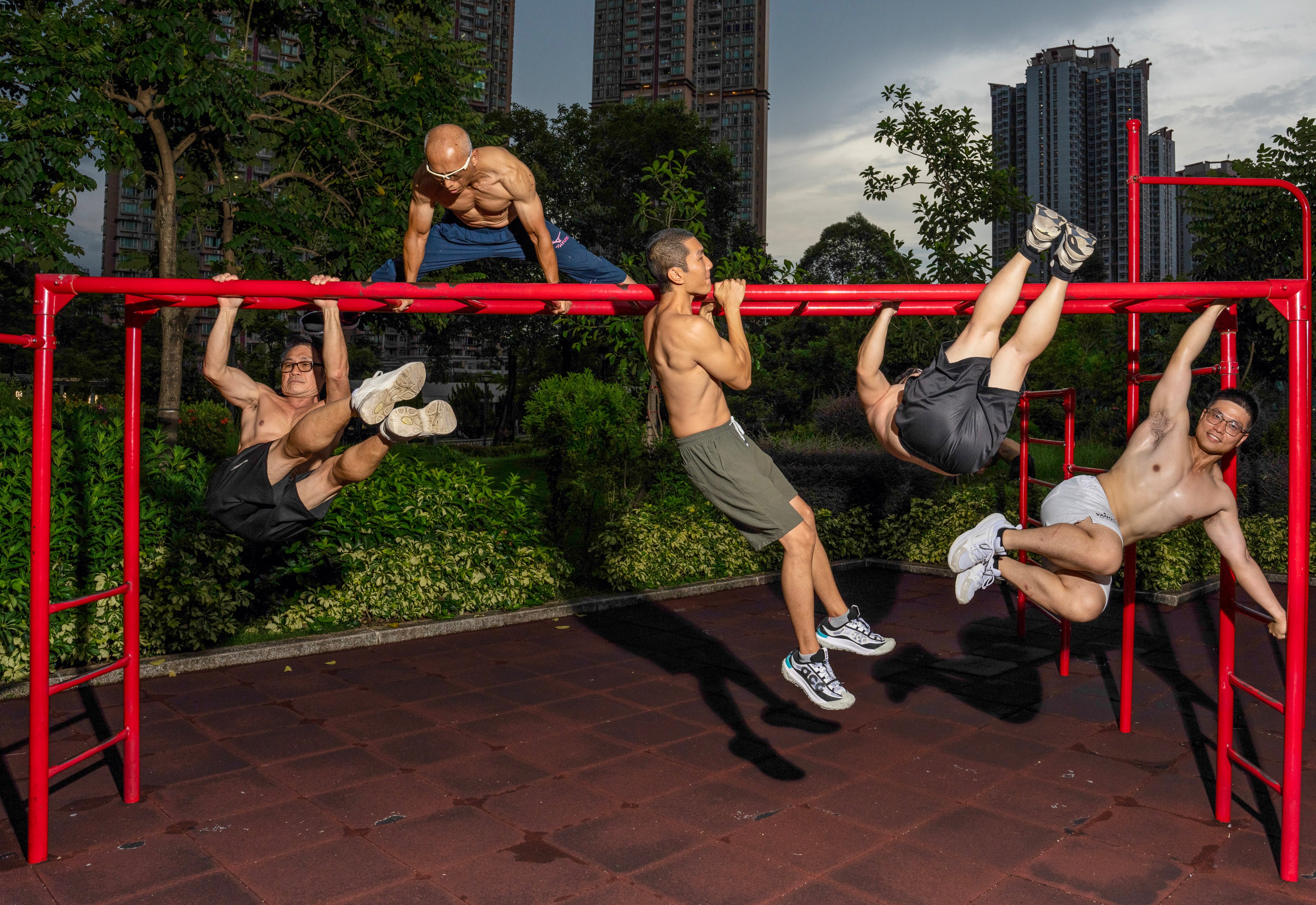 A group of Tin Shui Wai residents gather at their usual fitness corner for their daily street workout routine. Photo: Sam Tsang