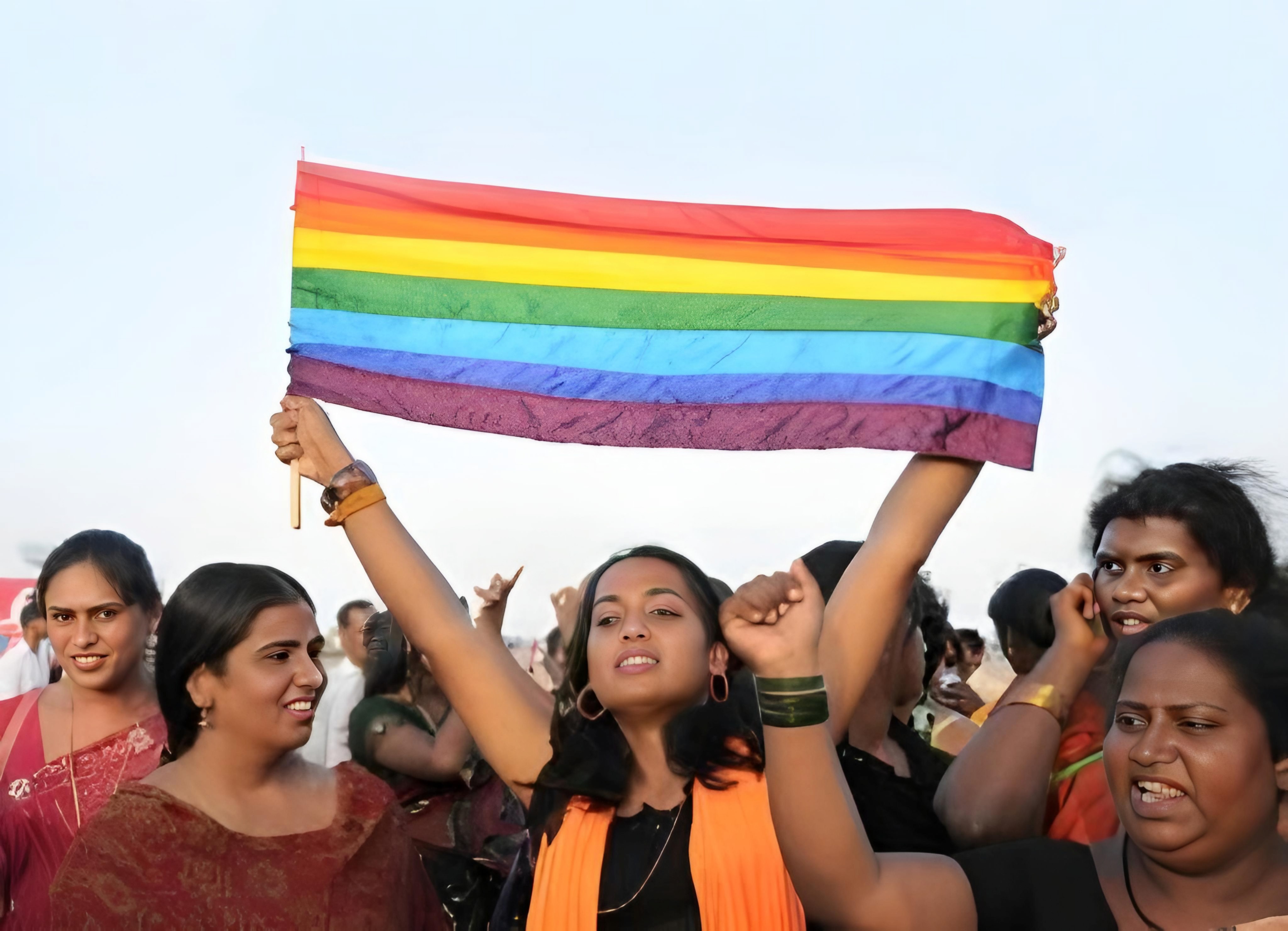 Transgender activists hold up an LGBTQ flag in India. Photo: Kalki Subramaniam