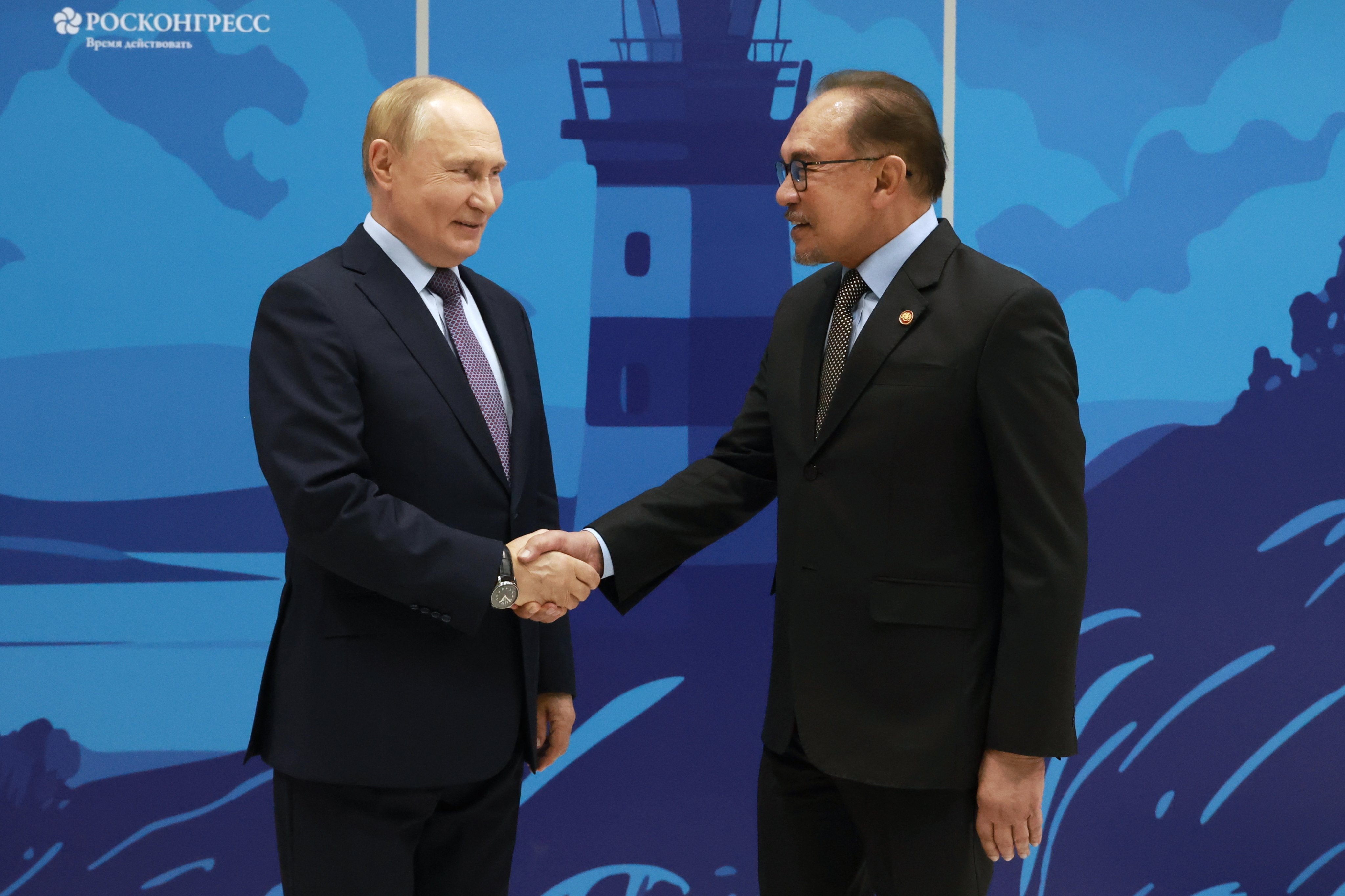 Russian President Vladimir Putin welcomes Malaysian Prime Minister Anwar Ibrahim before a meeting on the sidelines of the Eastern Economic Forum in Vladivostok, Russia, on September 4. Photo: EPA-EFE