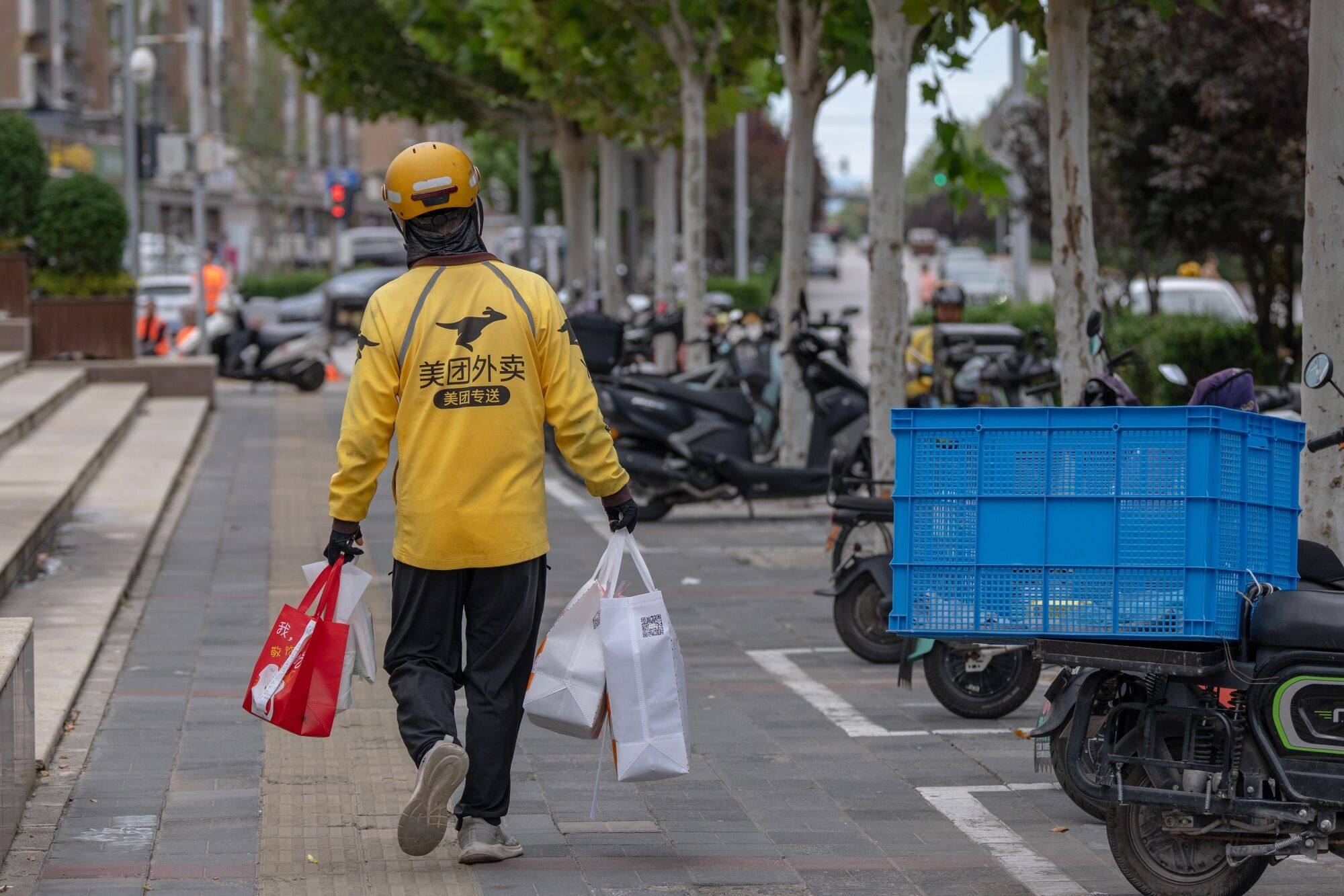 A Meituan food delivery courier in Beijing. Photo: Bloomberg