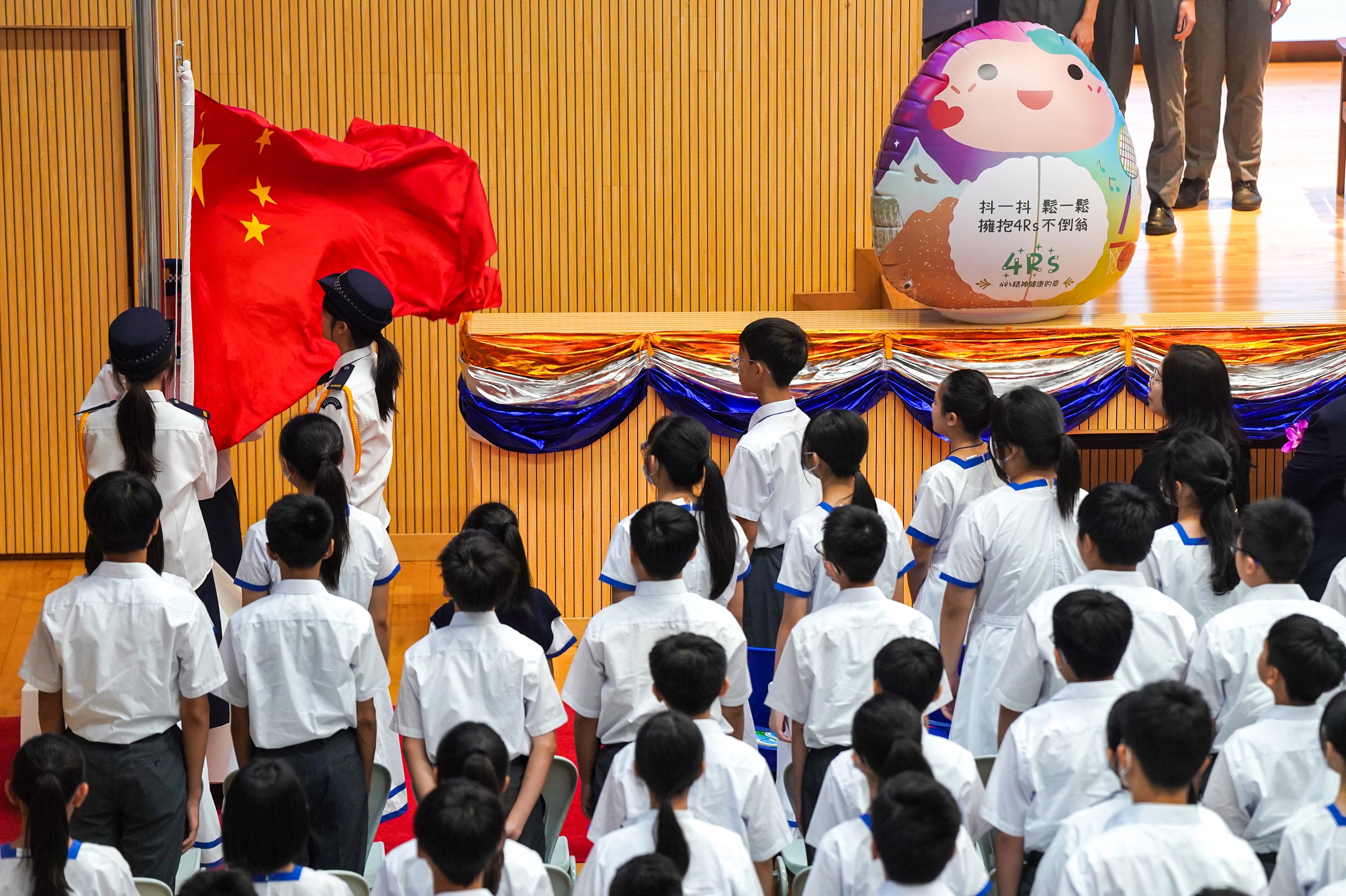 Students raise the national flag during a ceremony marking the start of the school year at a secondary school in Hong Kong’s Tuen Mun district on September 2. Photo: Elson Li