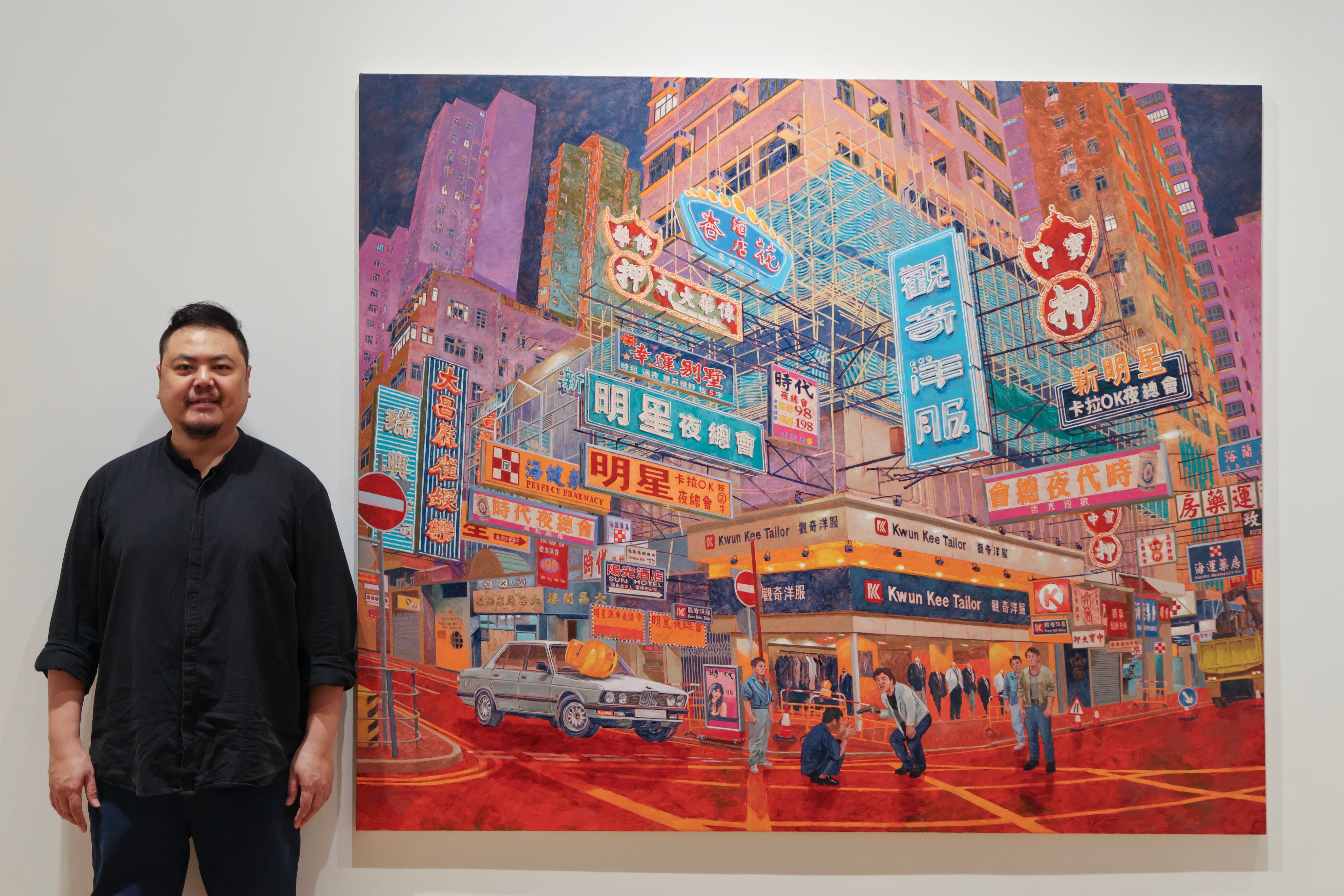 Chow Chun-fai next to his painting As Tears Go By 1988 at Mahjong School Portland Street (2024), part of his solo exhibition “Map of Amnesia” at Tang Contemporary Art in Central, Hong Kong. His paintings in the show depict city scenes as they are now and once were. Photo: Jelly Tse