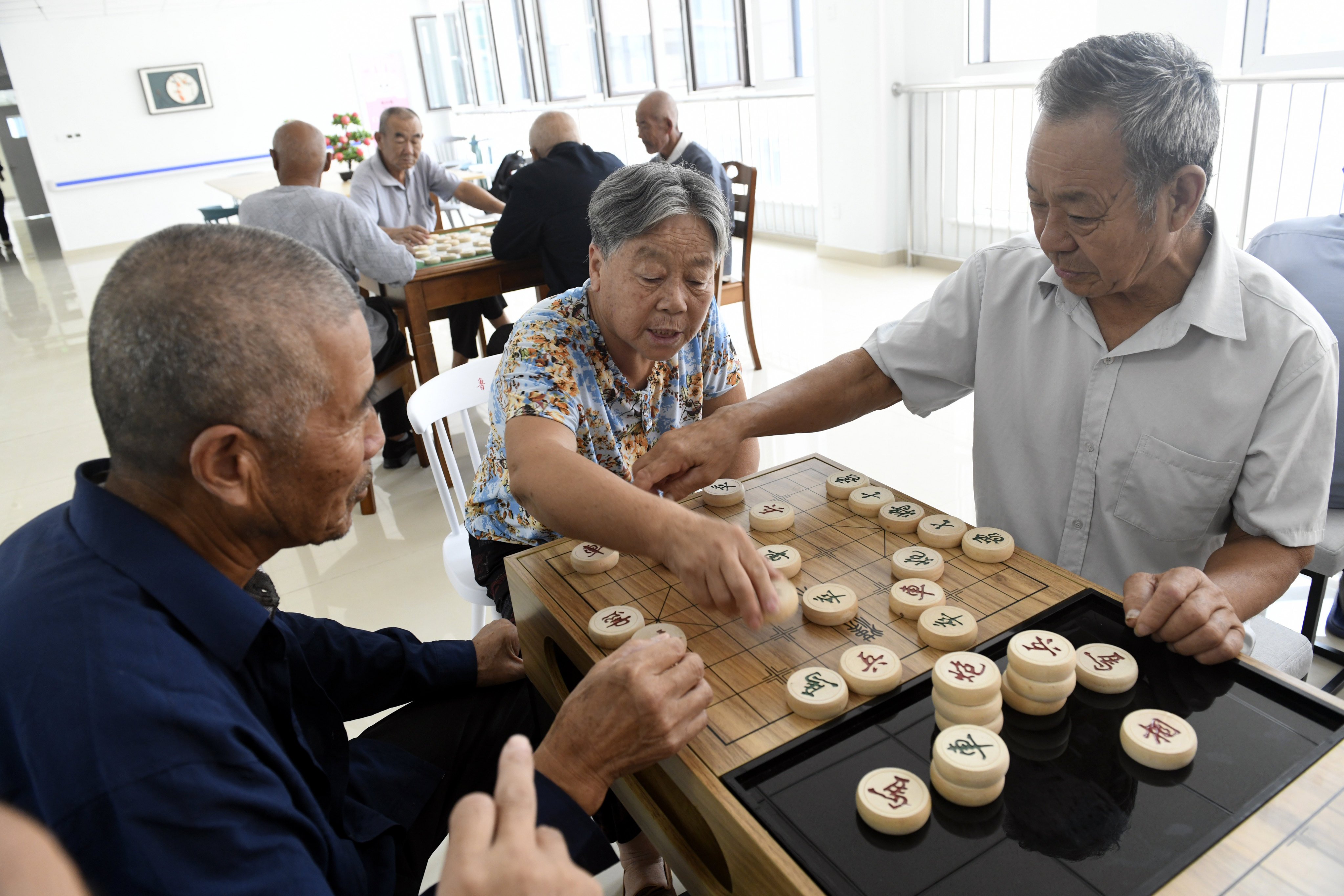 China is encouraging elderly people to volunteer in childcare, senior care, community patrols and help for the disabled. Photo: Xinhua