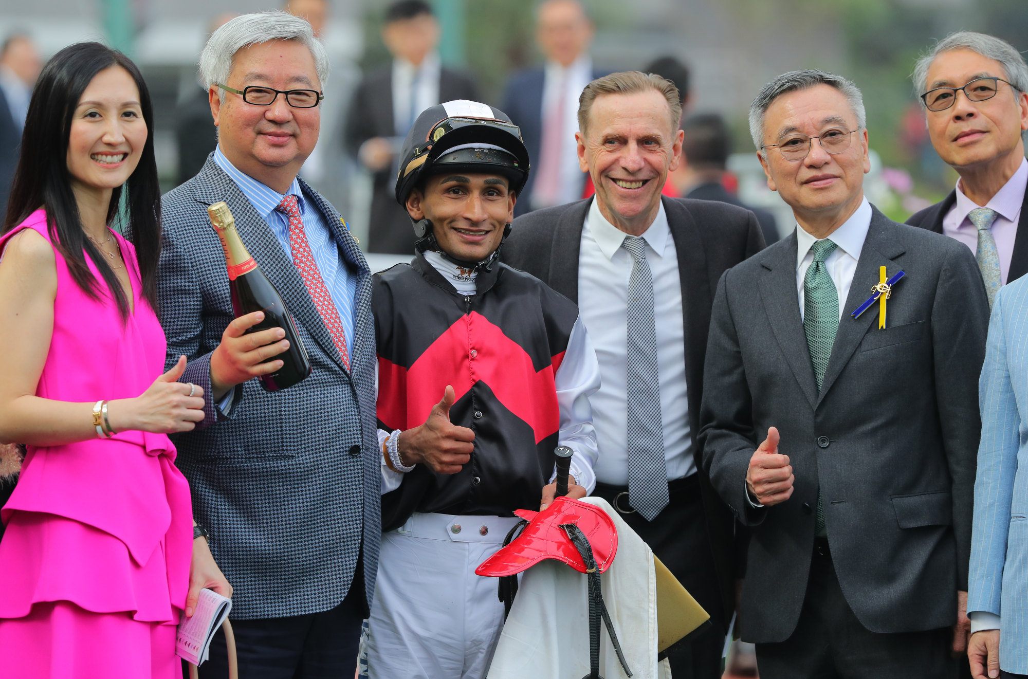 Jockey Karis Teetan and trainer John Size celebrate with connections.