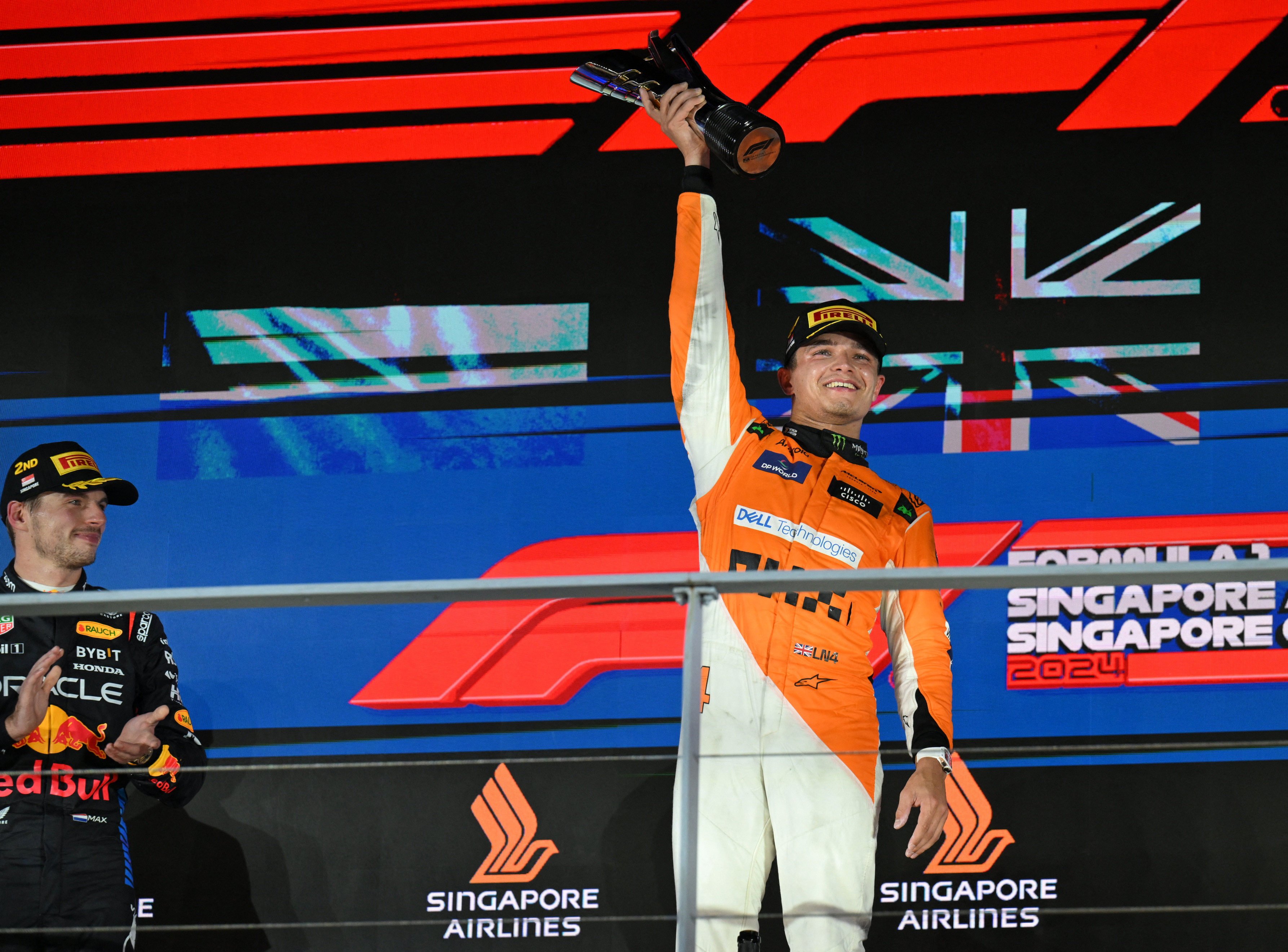 McLaren’s Lando Norris celebrates on the podium after winning the Singapore Grand Prix. Photo: Reuters