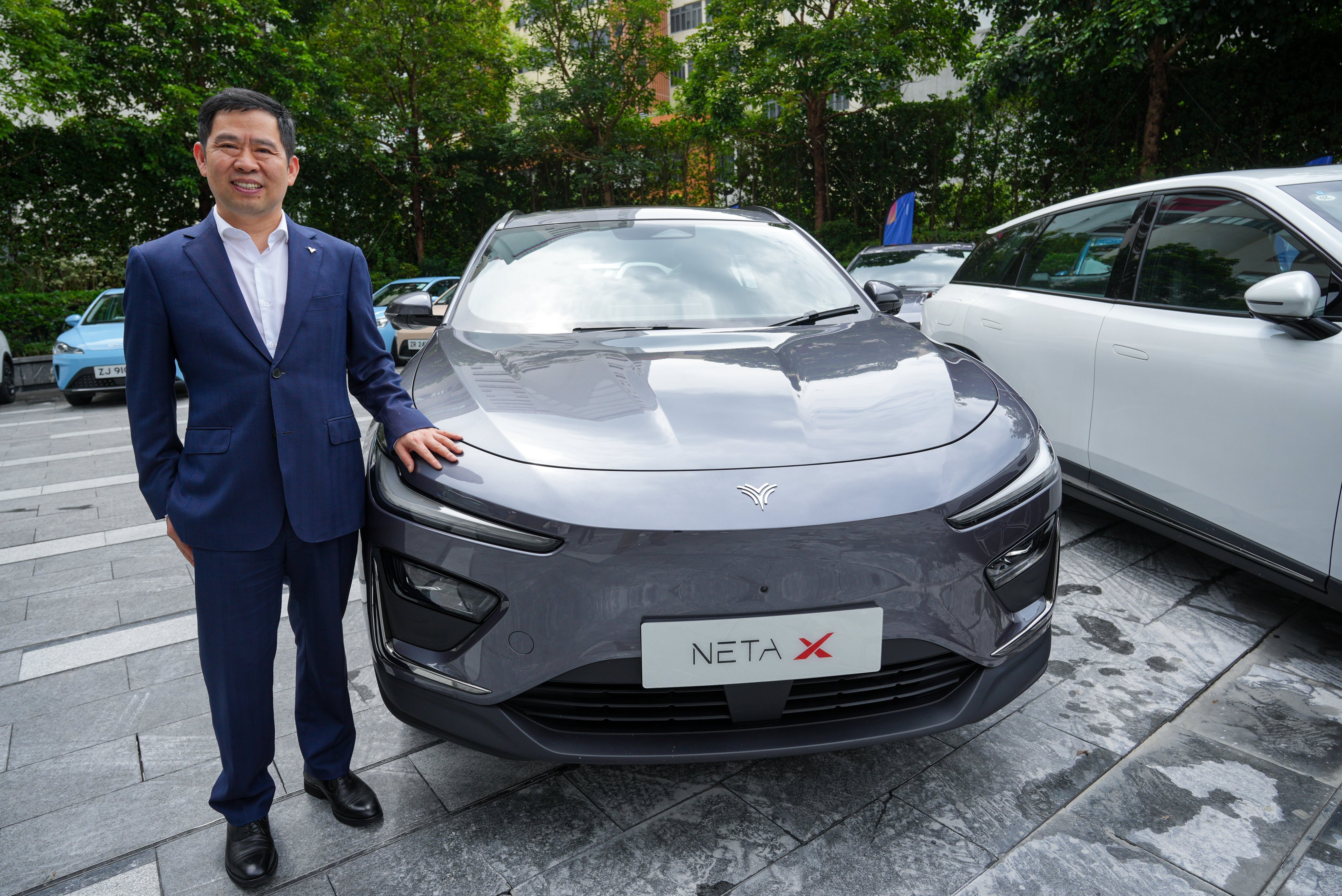 Hozon founder Fang Yunzhou standing next to a Neta X SUV in Sha Tin, Hong Kong on September 22. Photo: May Tse