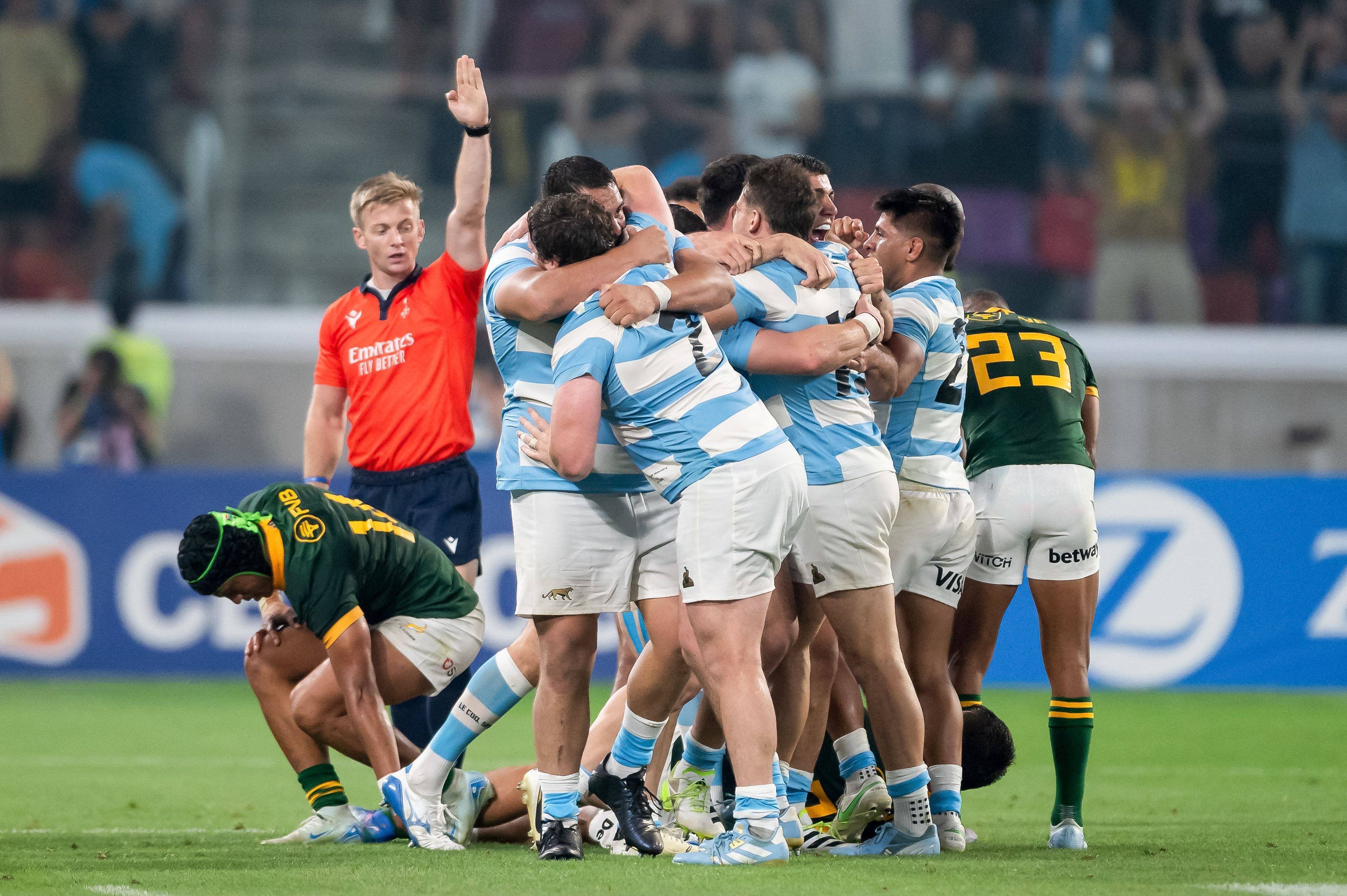 Argentine players celebrate after defeating world champions South Africa on Saturday, and giving themselves an outside chance of winning the title next week. Photo: AFP