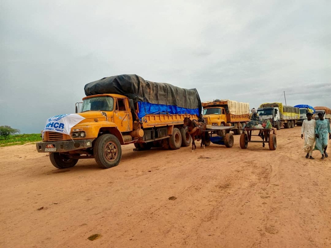 Aid trucks bound for Sudan’s Darfur region, at a location given as the border of Chad and Sudan, August 21, 2024. Photo: UNHCR via Reuters