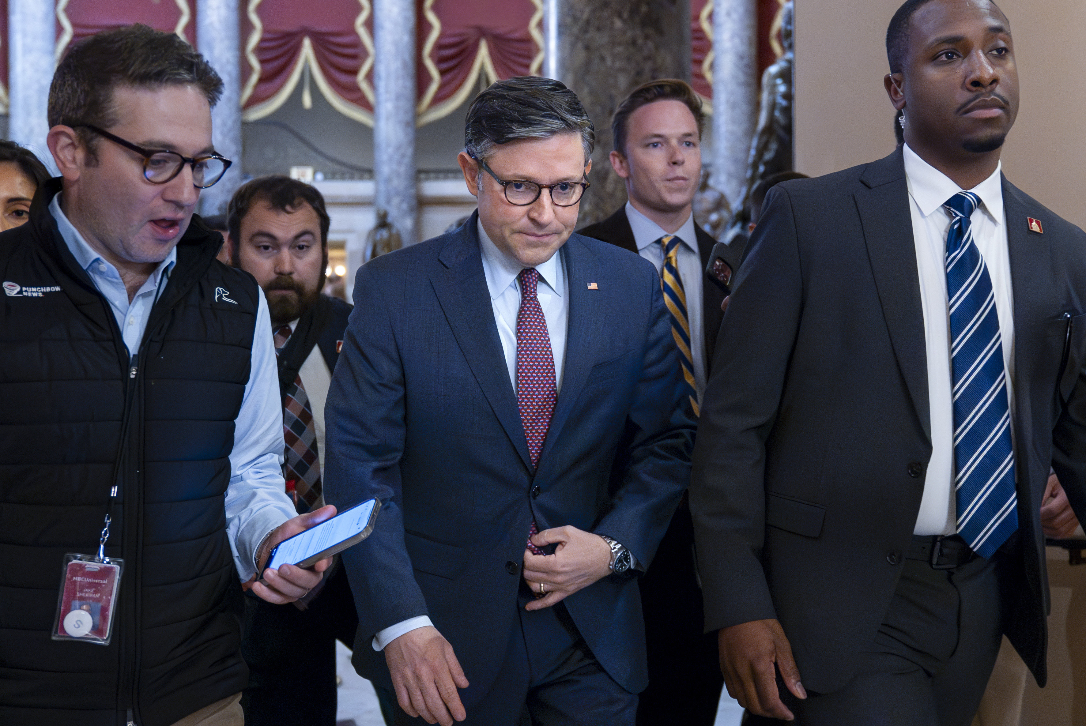 US House Speaker Mike Johnson, centre, at the Capitol in Washington on Friday. Photo: AP