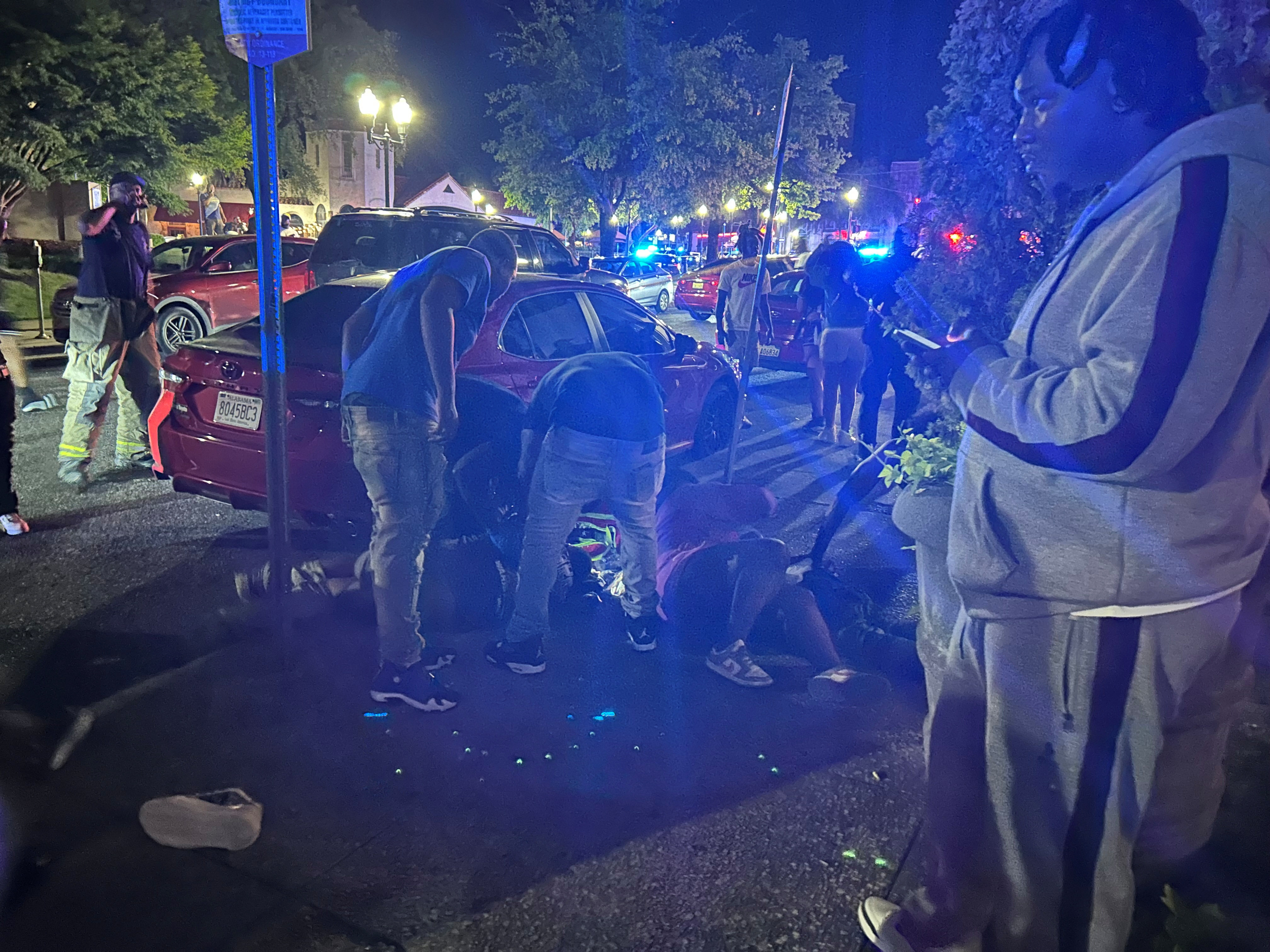 Victims lie on the ground as police respond to the deadly shooting. Photo: Drew Hawkins, Gulf States Newsroom via Reuters