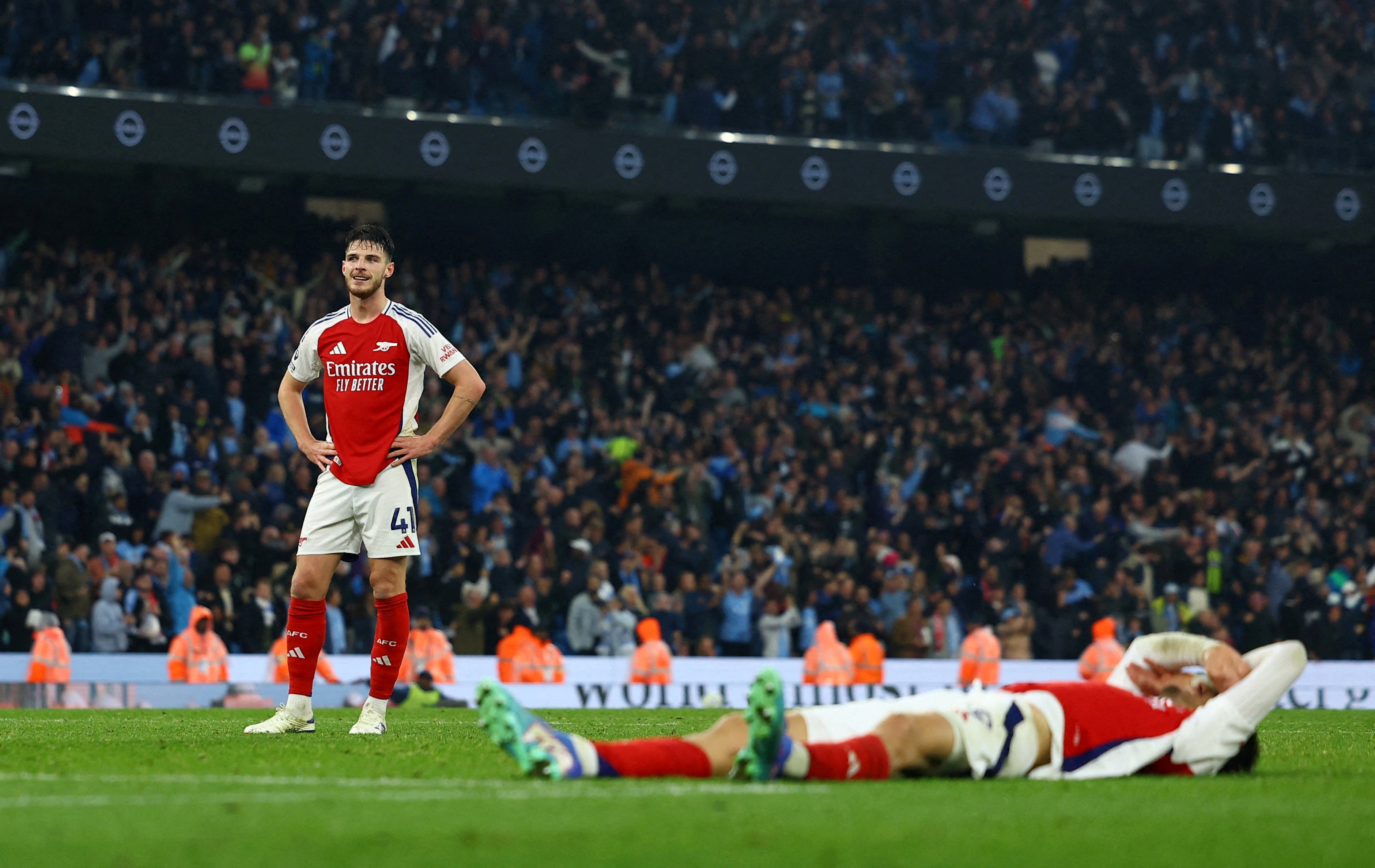 Arsenal’s Declan Rice looks dejected after Manchester City’s John Stones scores a late equaliser. Photo: Reuters