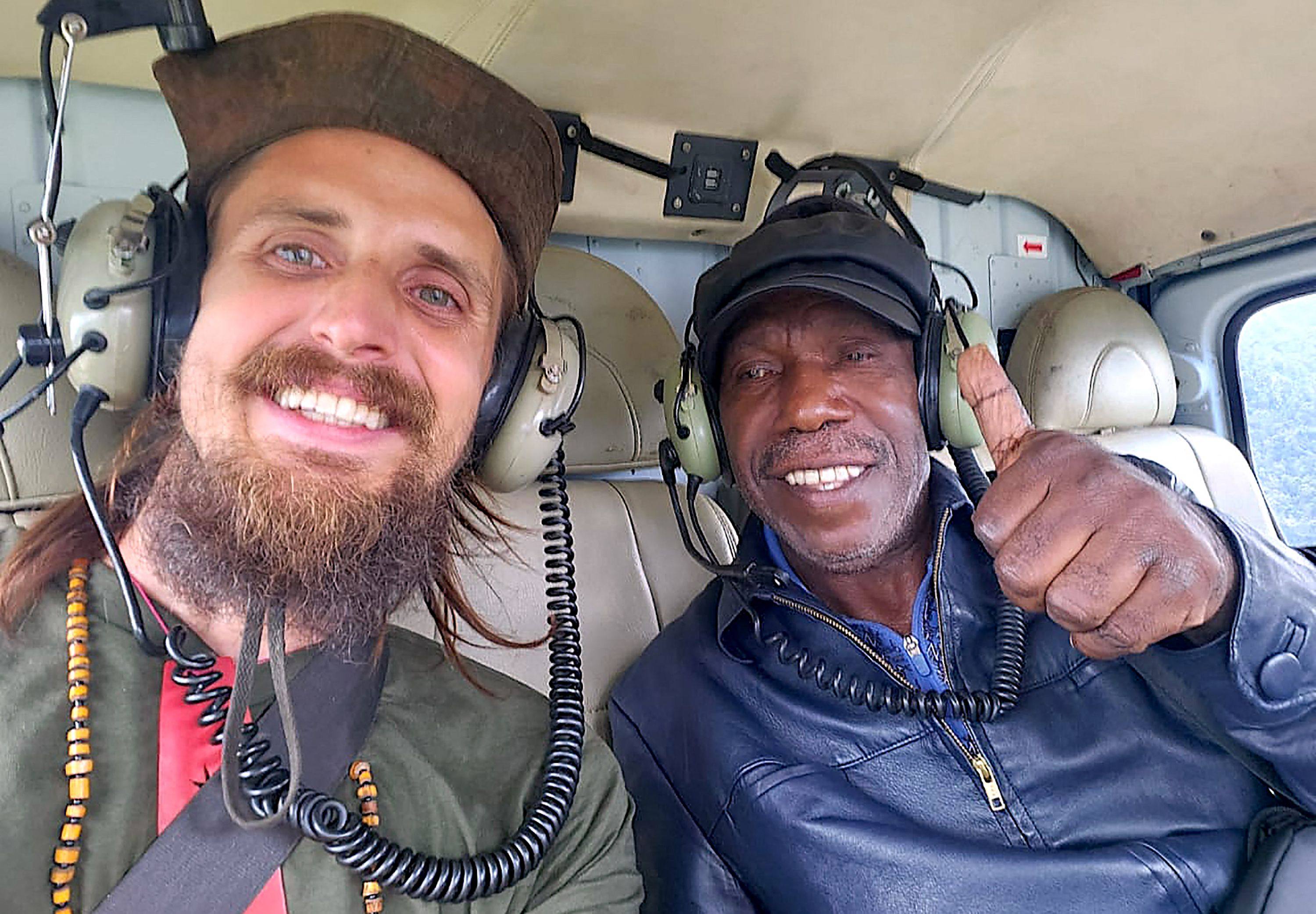 Phillip Mehrtens (left) pictured with Edison Gwijangge after being released from captivity on Saturday. Rebels in Indonesia’s Papua region claimed they received money for Mehrtens’ release. Photo: New Zealand Ministry of Foreign Affairs and Trade / AFP