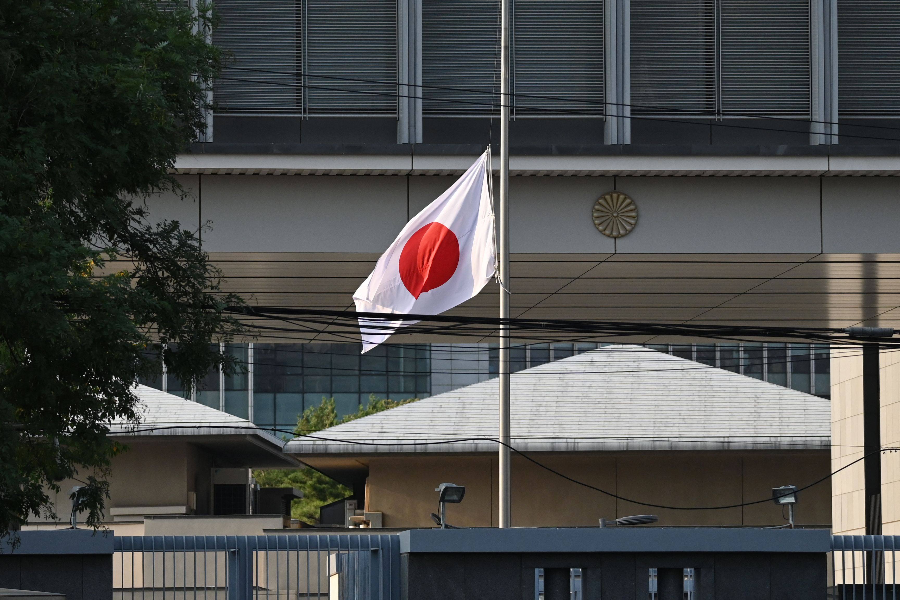 The Japanese embassy in Beijing flies the national flag at half mast on September 19, after the 10-year-old attacked in Shenzhen died of his injuries. Photo: AFP 