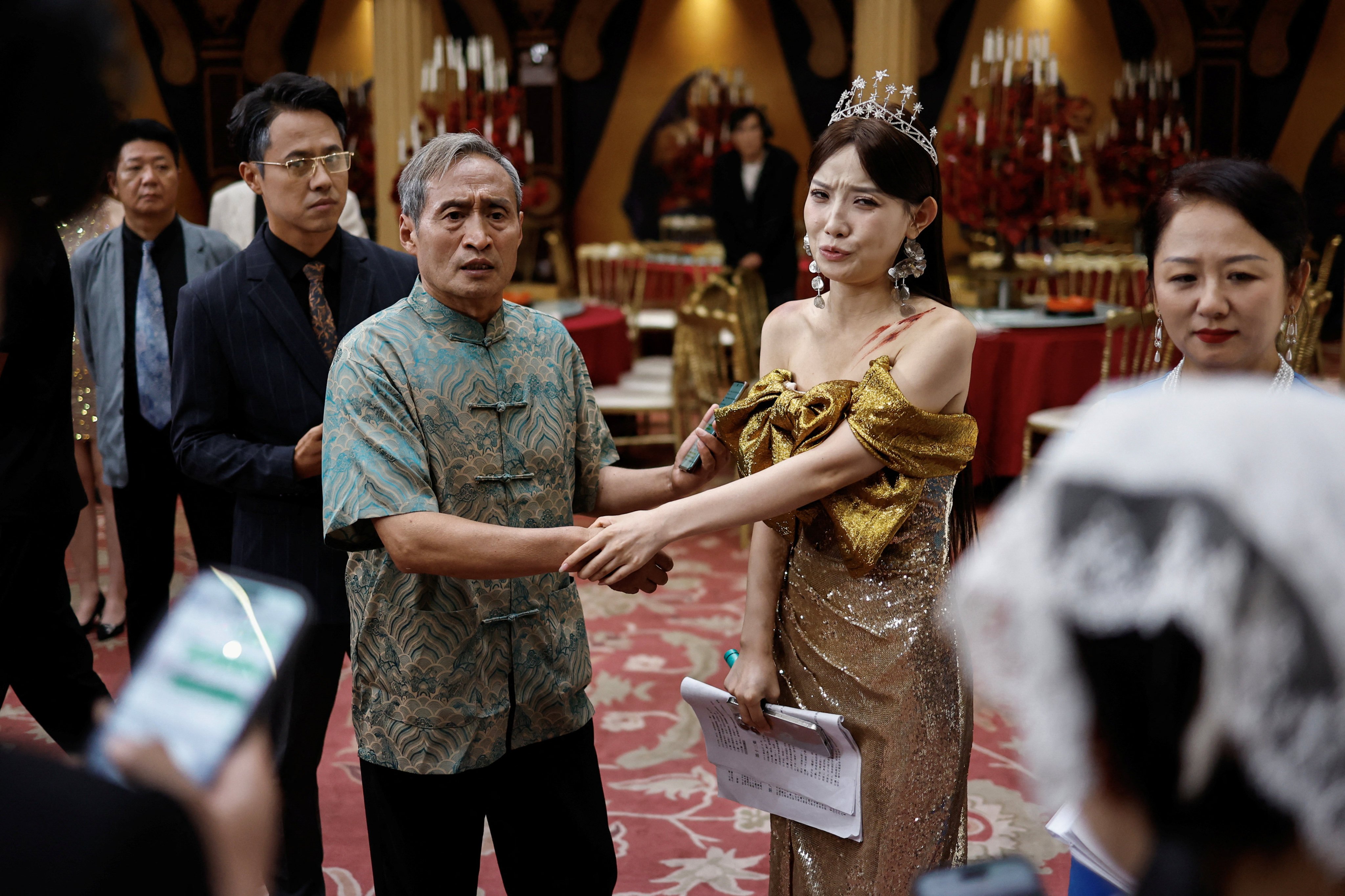 Zhu Jian (centre, left), 69, rehearses with other actors on the set of the micro drama Grandma’s Moon in Zhengzhou, Henan province, China, on July 16, 2024. Photo: Reuters