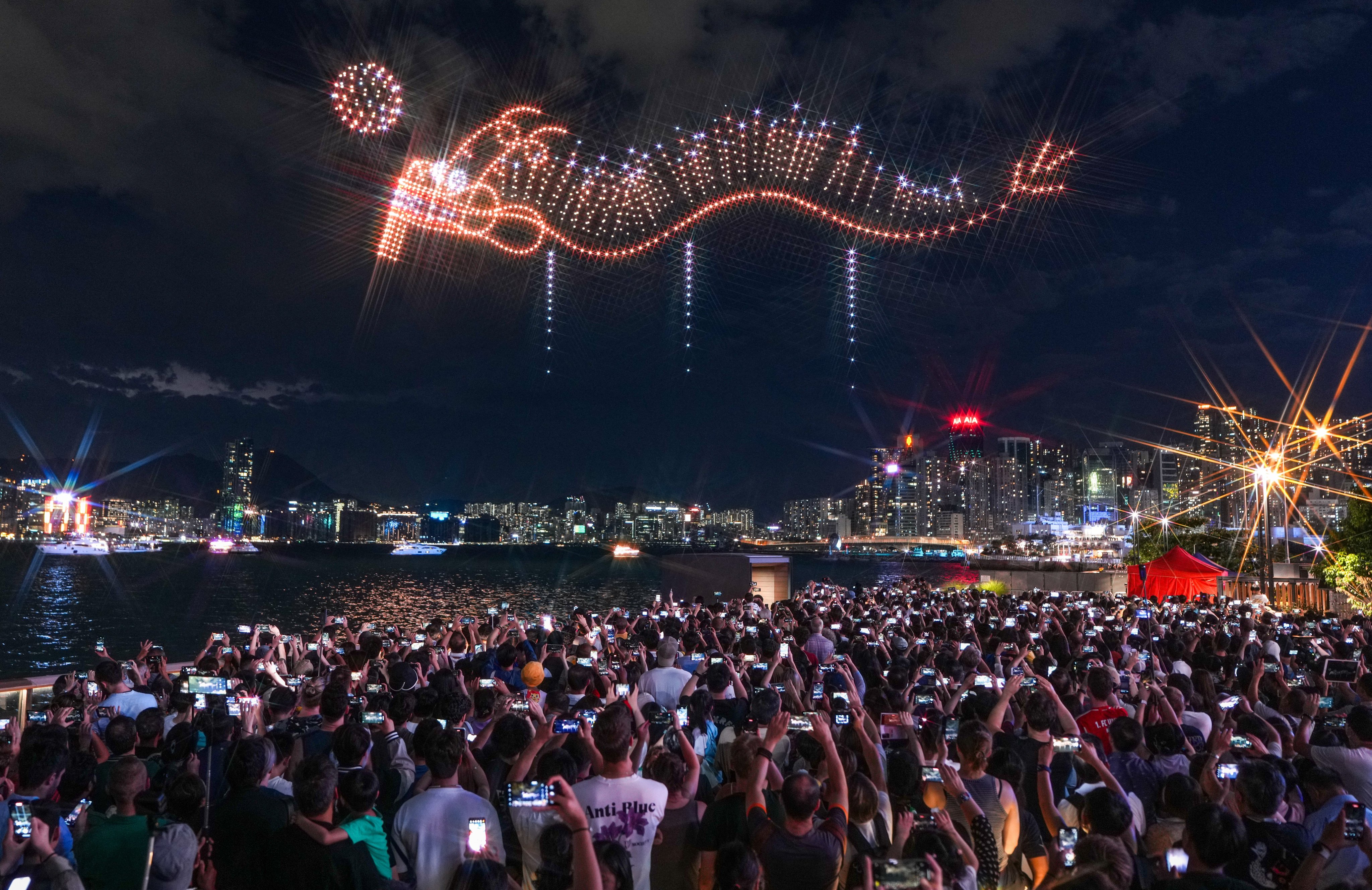 A drone show during the Mid-Autumn Festival is a hit with spectators at the harbourfront in Wan Chai. Photo: Eugene Lee