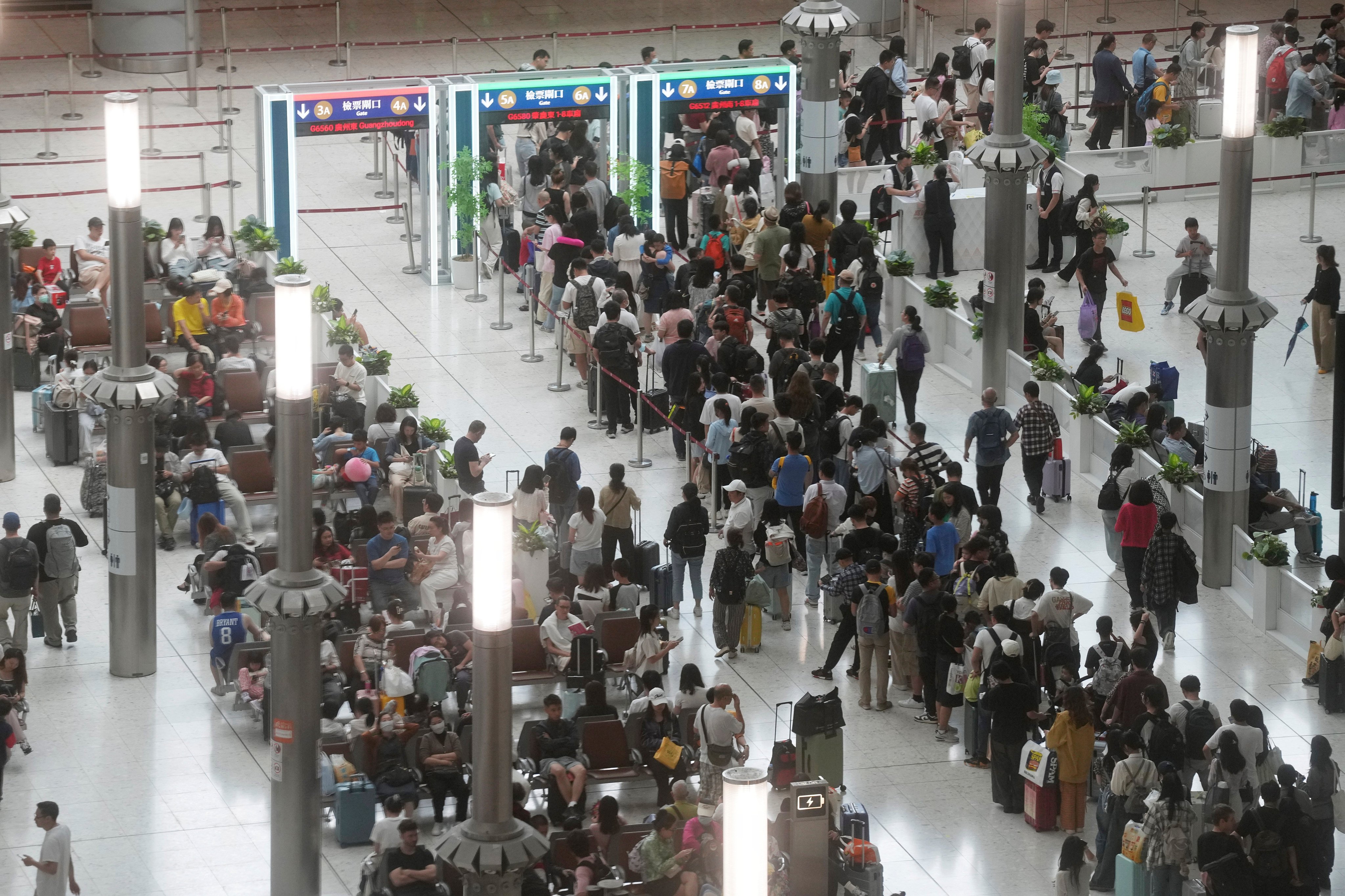 Extra frontline officers will be deployed at border crossings to operate clearance counters and kiosks, as well as manage passenger flow. Photo: Elson Li