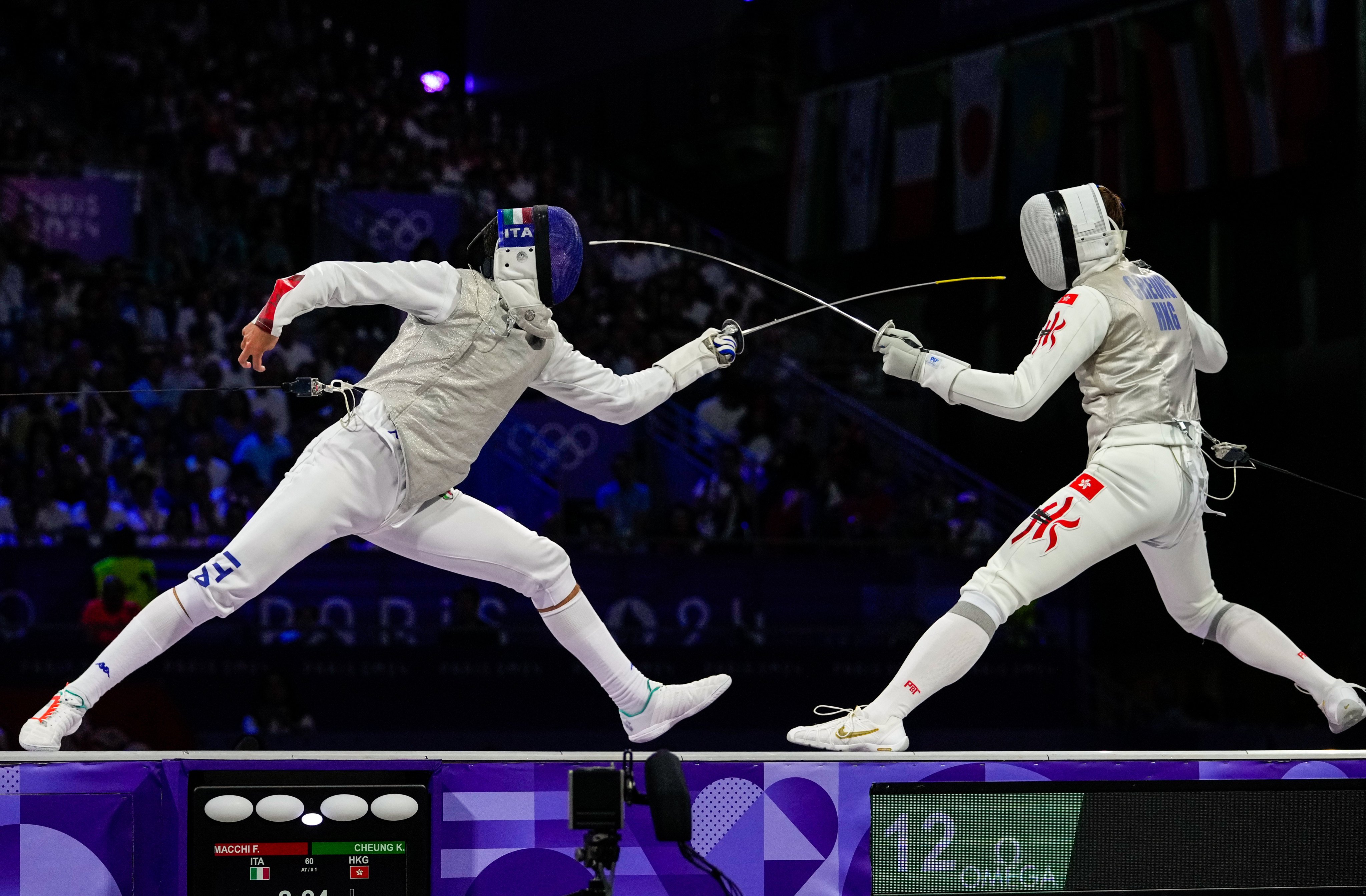 Hong Kong’s Cheung Ka-long (right) takes on Italy’s Filippo Macchi for the Olympic gold medal in Paris. Photo: AP Photo