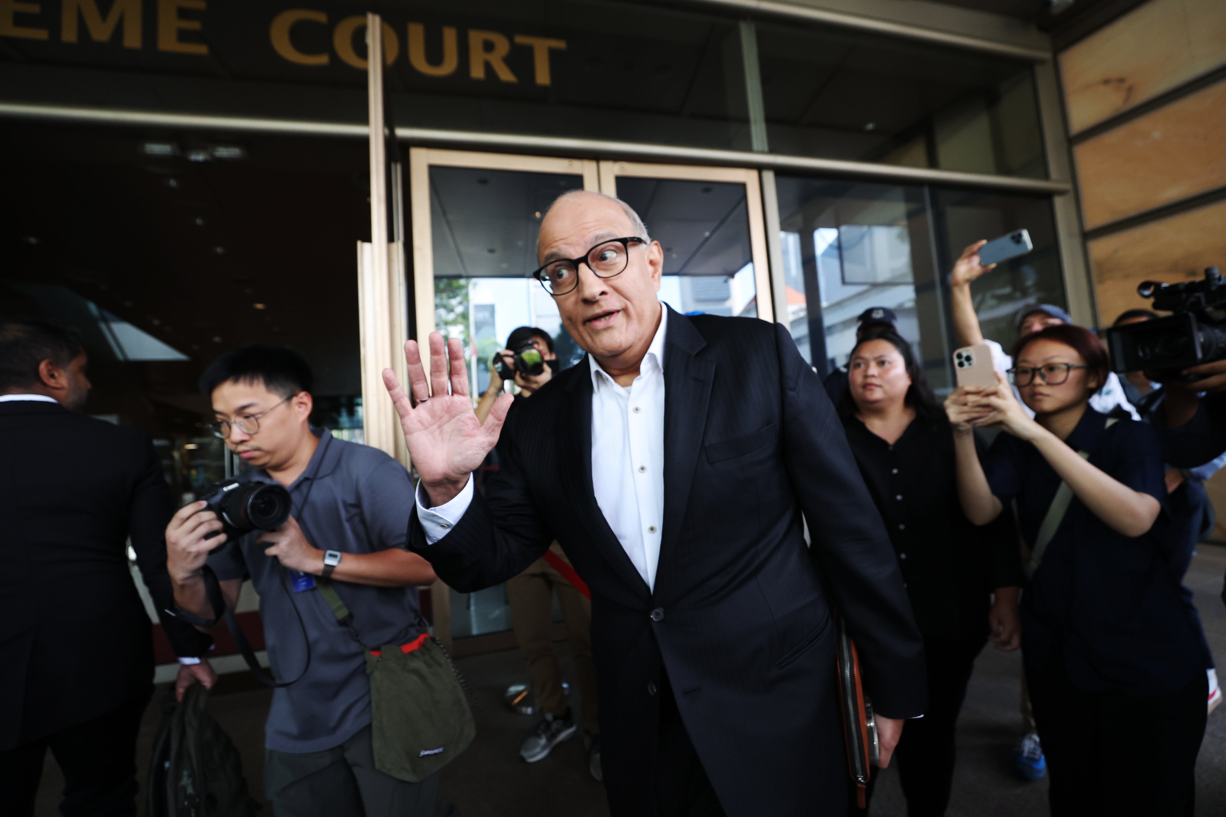 Singapore’s former transport minister S. Iswaran (centre) arrives at the High Court on Tuesday. Photo: EPA-EFE