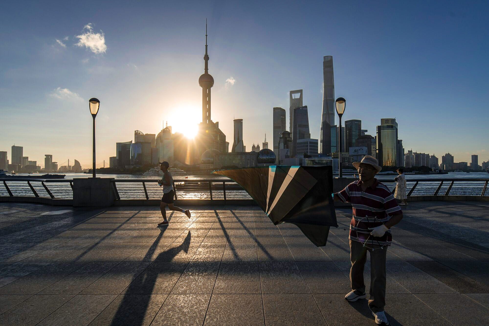 Pedestrians on the Bund in Shanghai. Photo: Bloomberg 