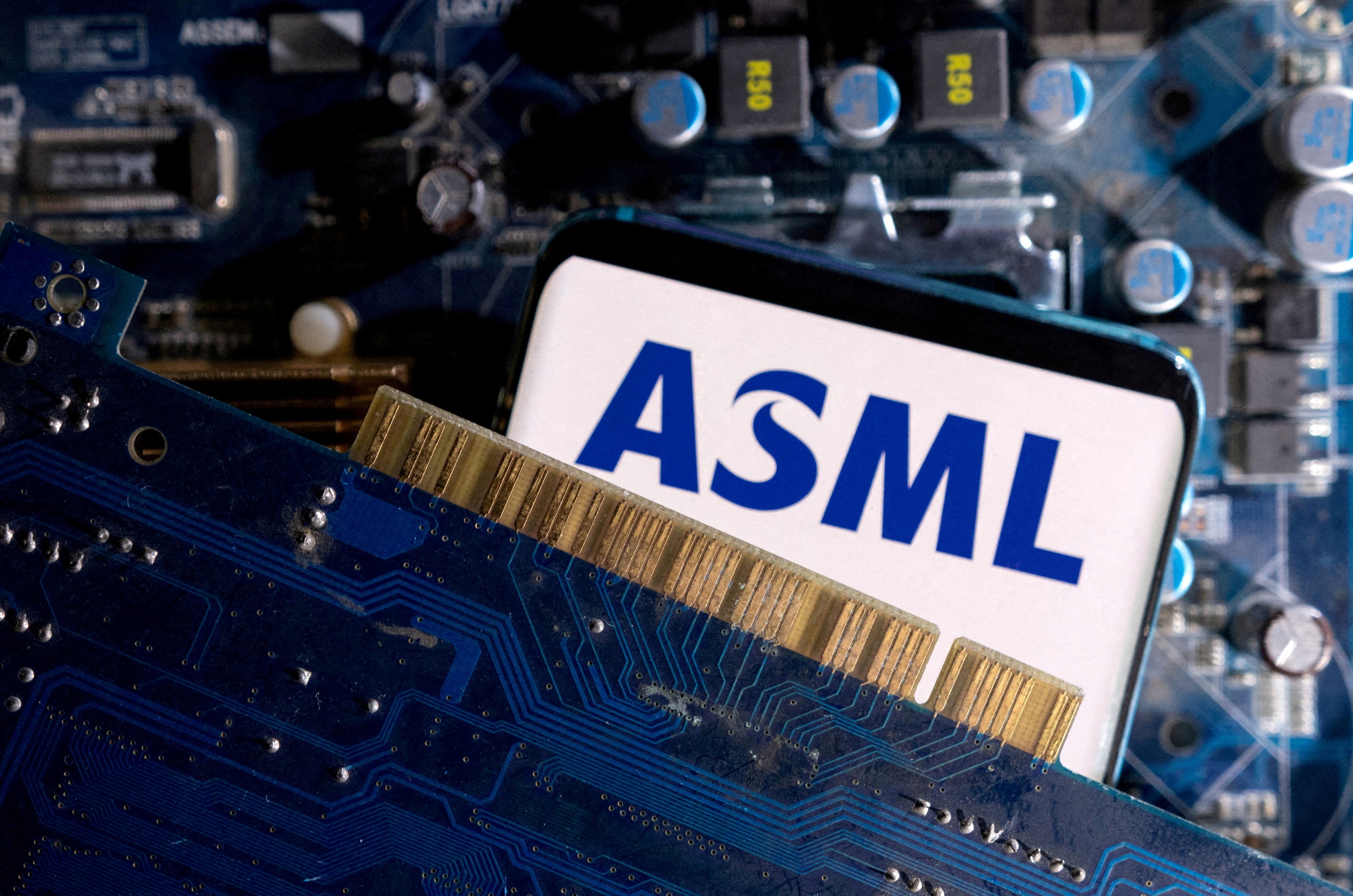 A smartphone with a displayed ASML logo is placed on a computer motherboard in this illustration taken March 6, 2023. Photo: Reuters