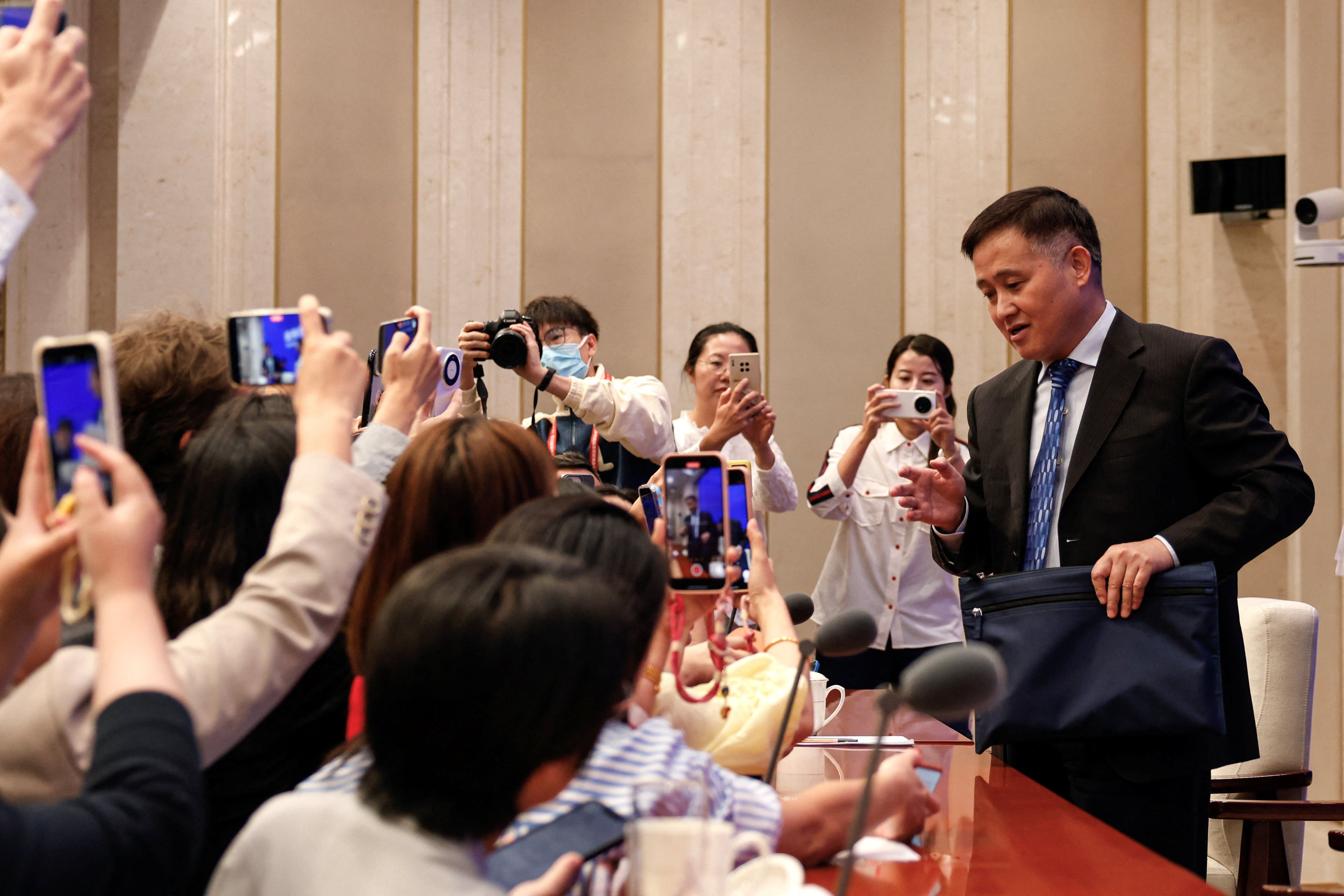 China’s central bank governor, Pan Gongsheng, speaks at a press conference in Beijing on Tuesday. Photo: Reuters