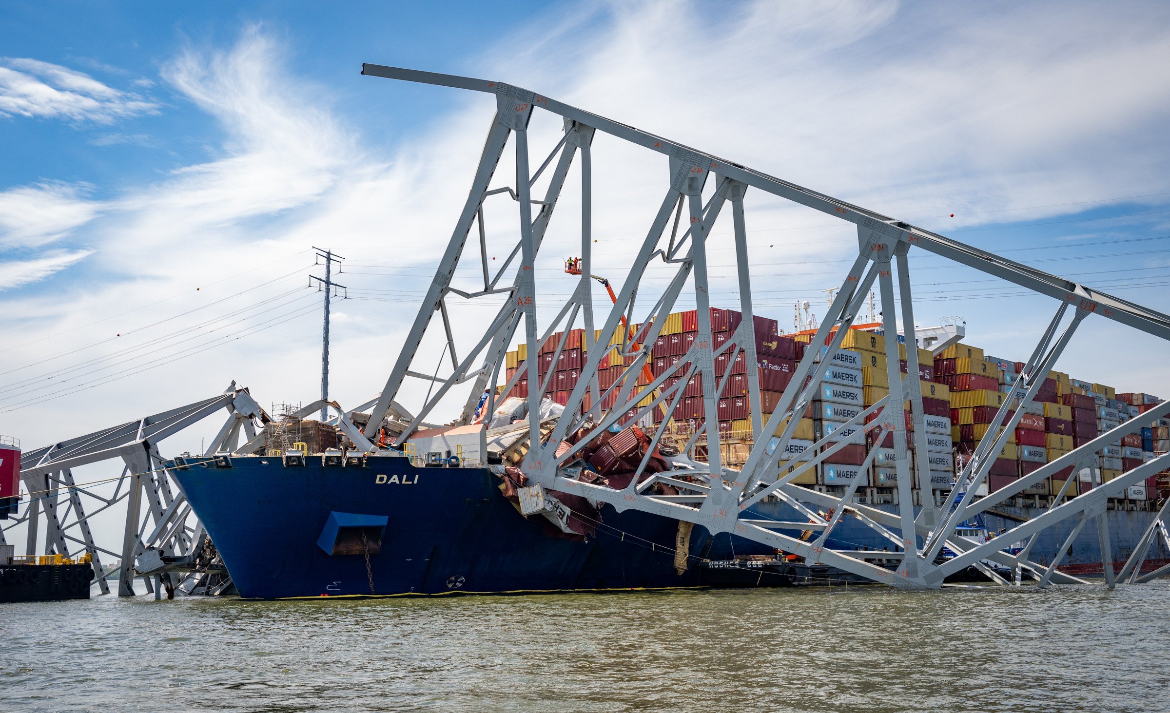 Workers prepare to remove the wreckage of the Francis Scott Key Bridge from the container ship Dali in April, five weeks after the catastrophic collapse. Photo: Baltimore Sun via TNS