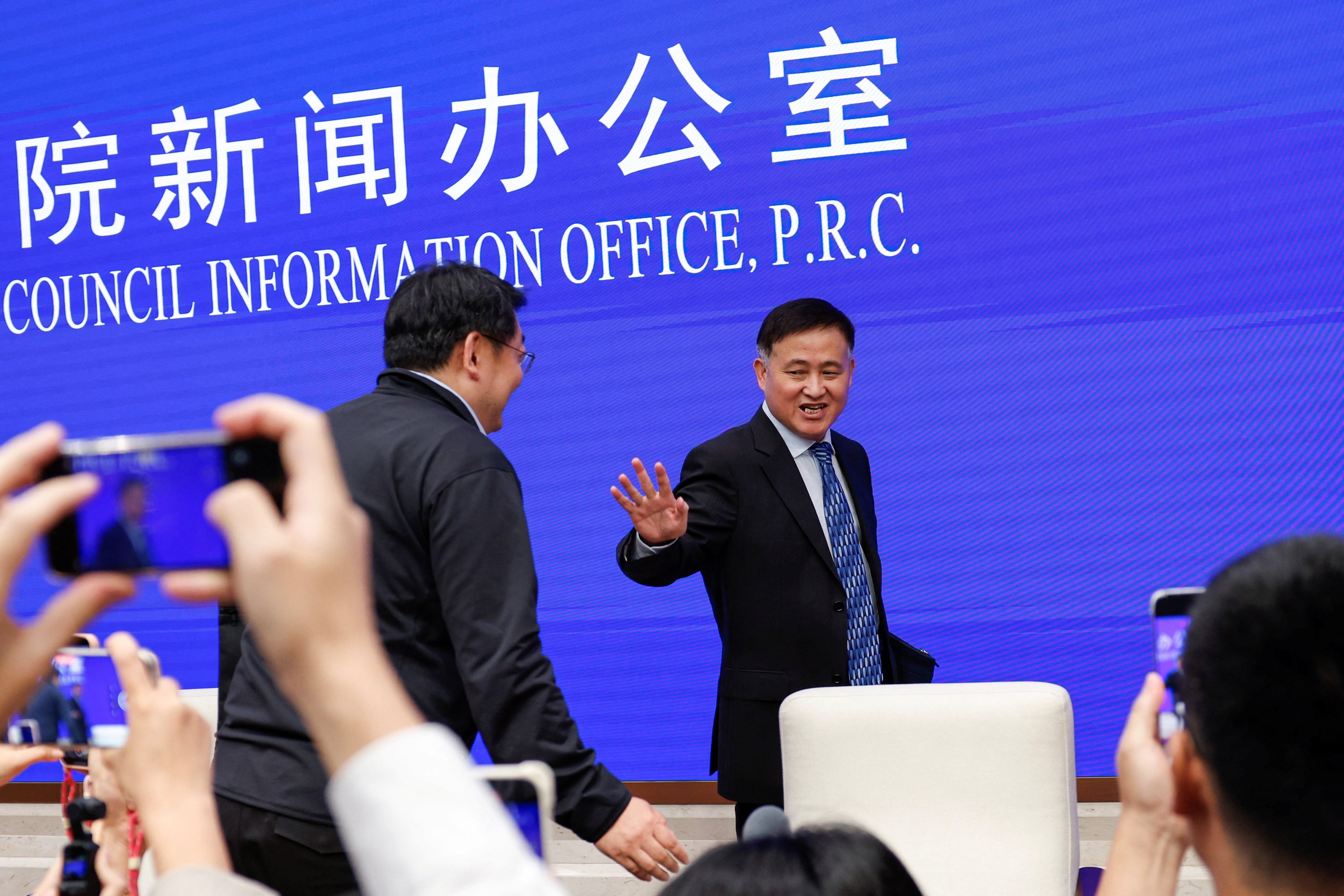 People’s Bank of China governor Pan Gongsheng leaves after a press conference in Beijing on Tuesday. Photo: Reuters