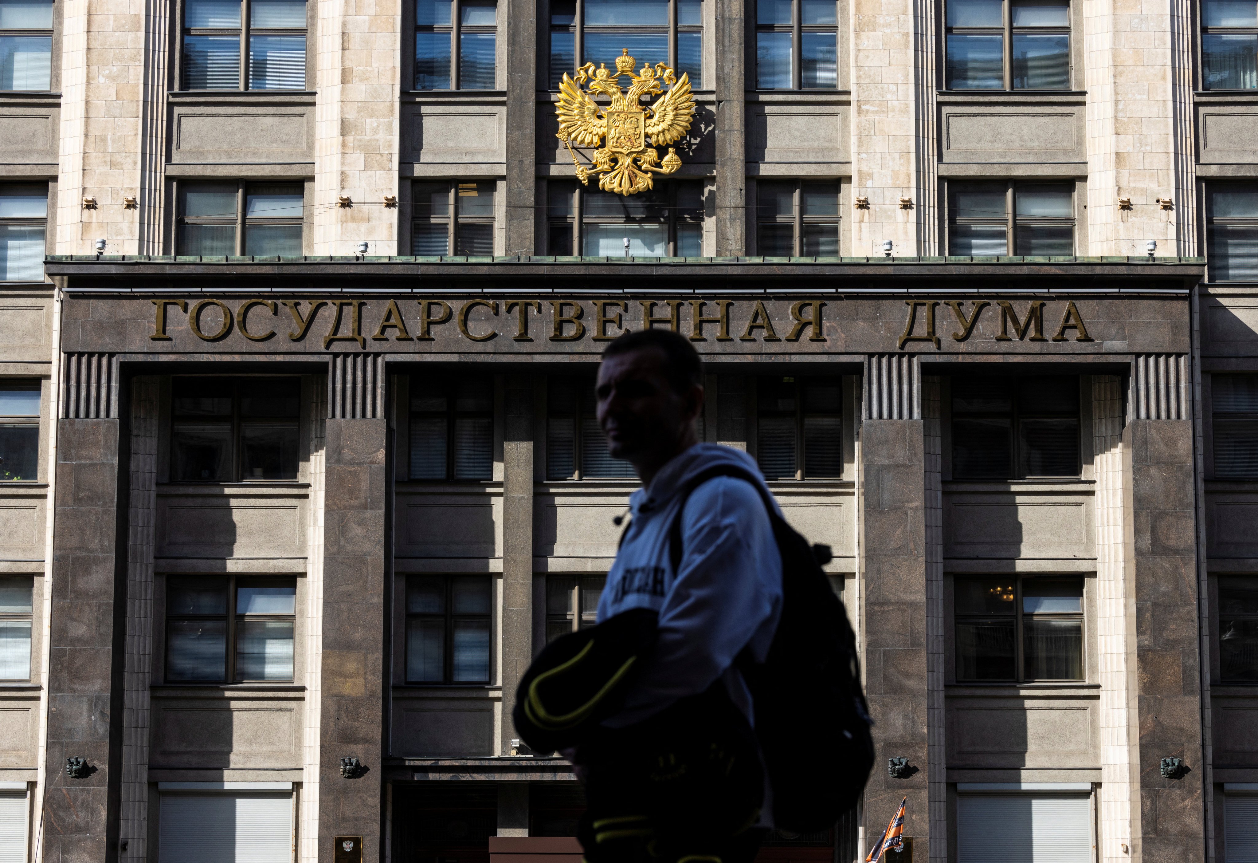 A man passes by the State Duma building, the lower chamber of Russian parliament in Moscow. Moscow has long portrayed itself as a bulwark against liberal values, but that trend has hugely accelerated since the Ukraine war. Photo: Reuters