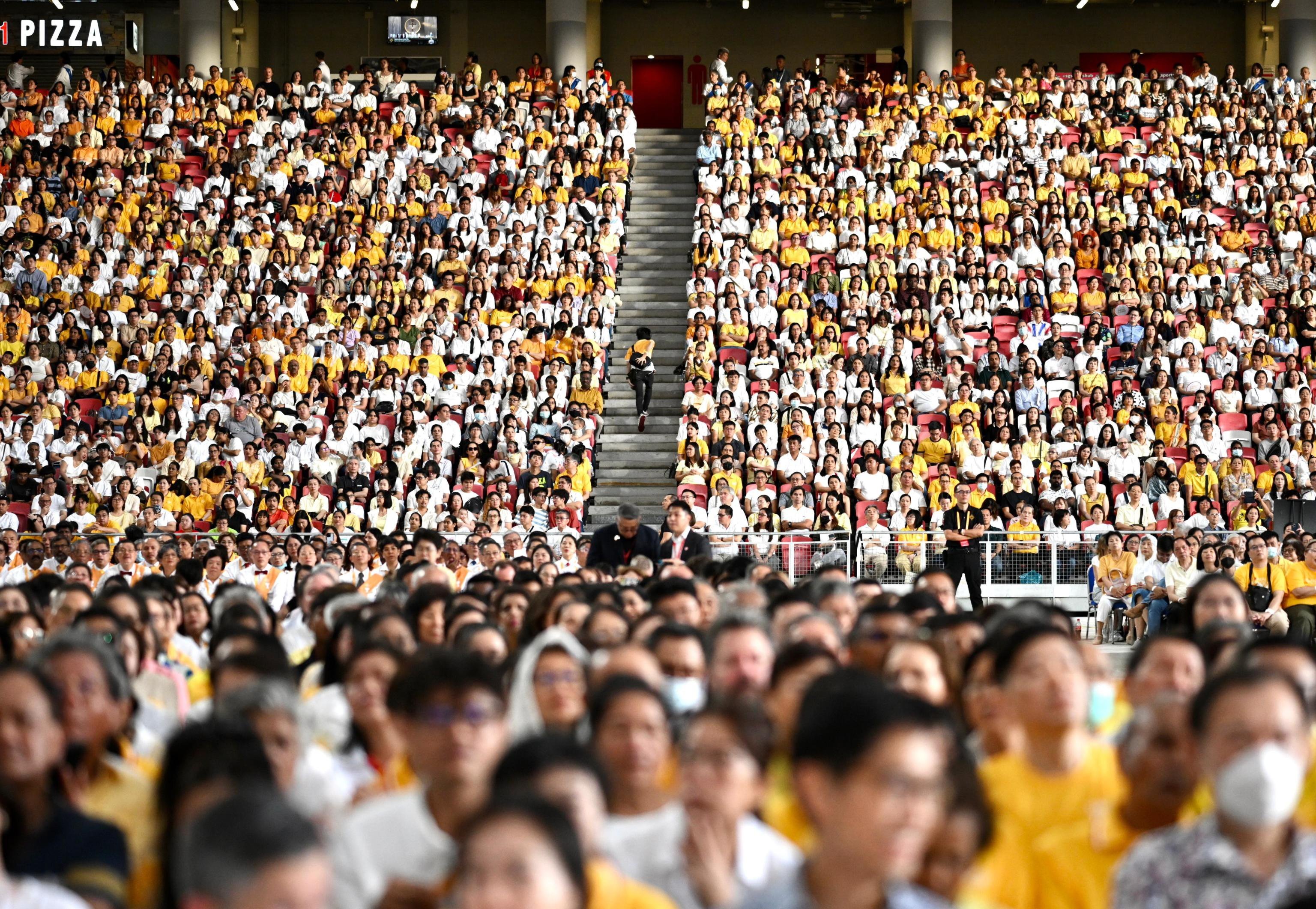 People pack the stands at Singapore’s National Stadium on September 12 for a Catholic mass led by Pope Francis. Photo: EPA-EFE