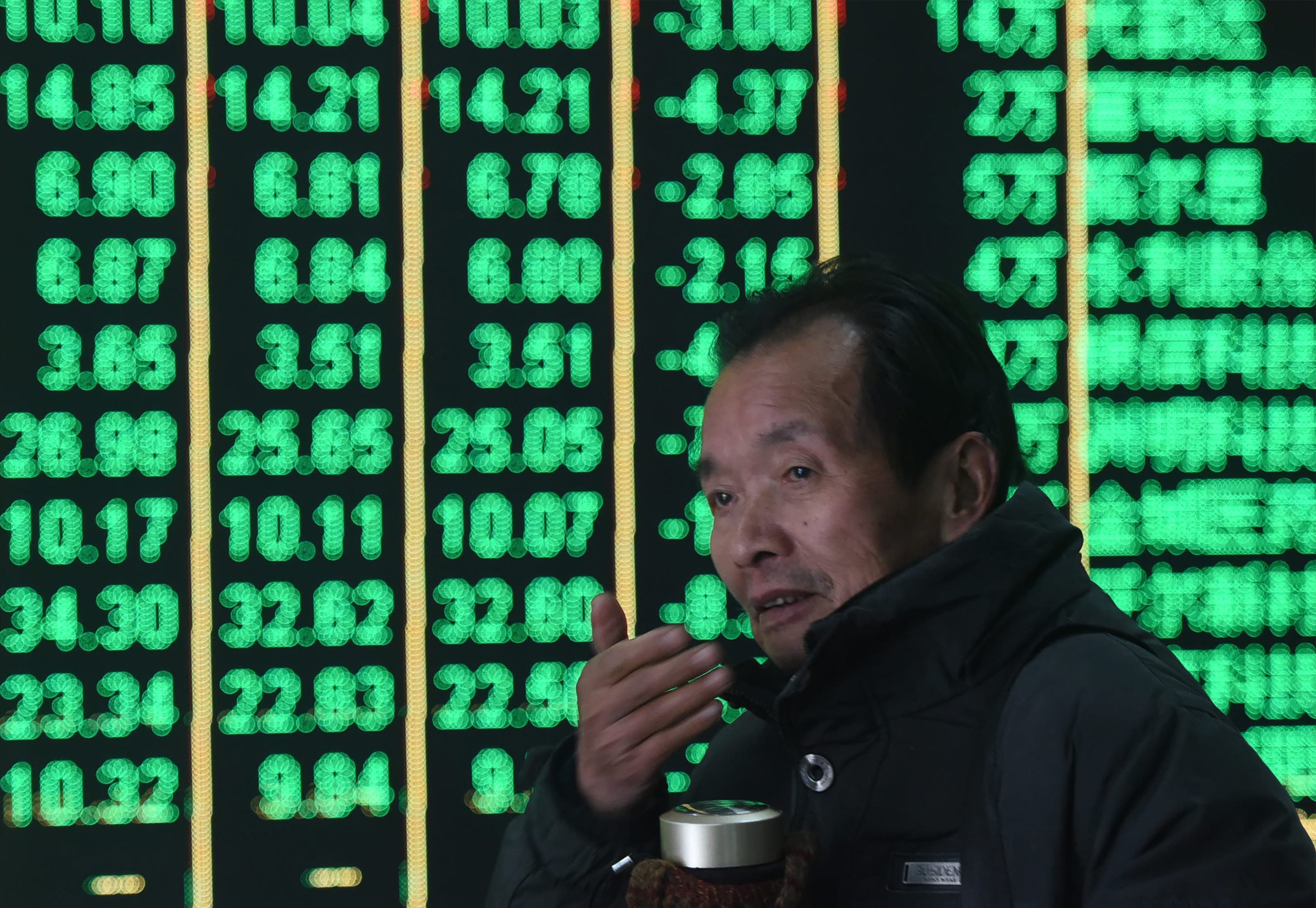 A man at a brokerage in Hangzhou. Photo: CFOTO/Future Publishing via Getty Images