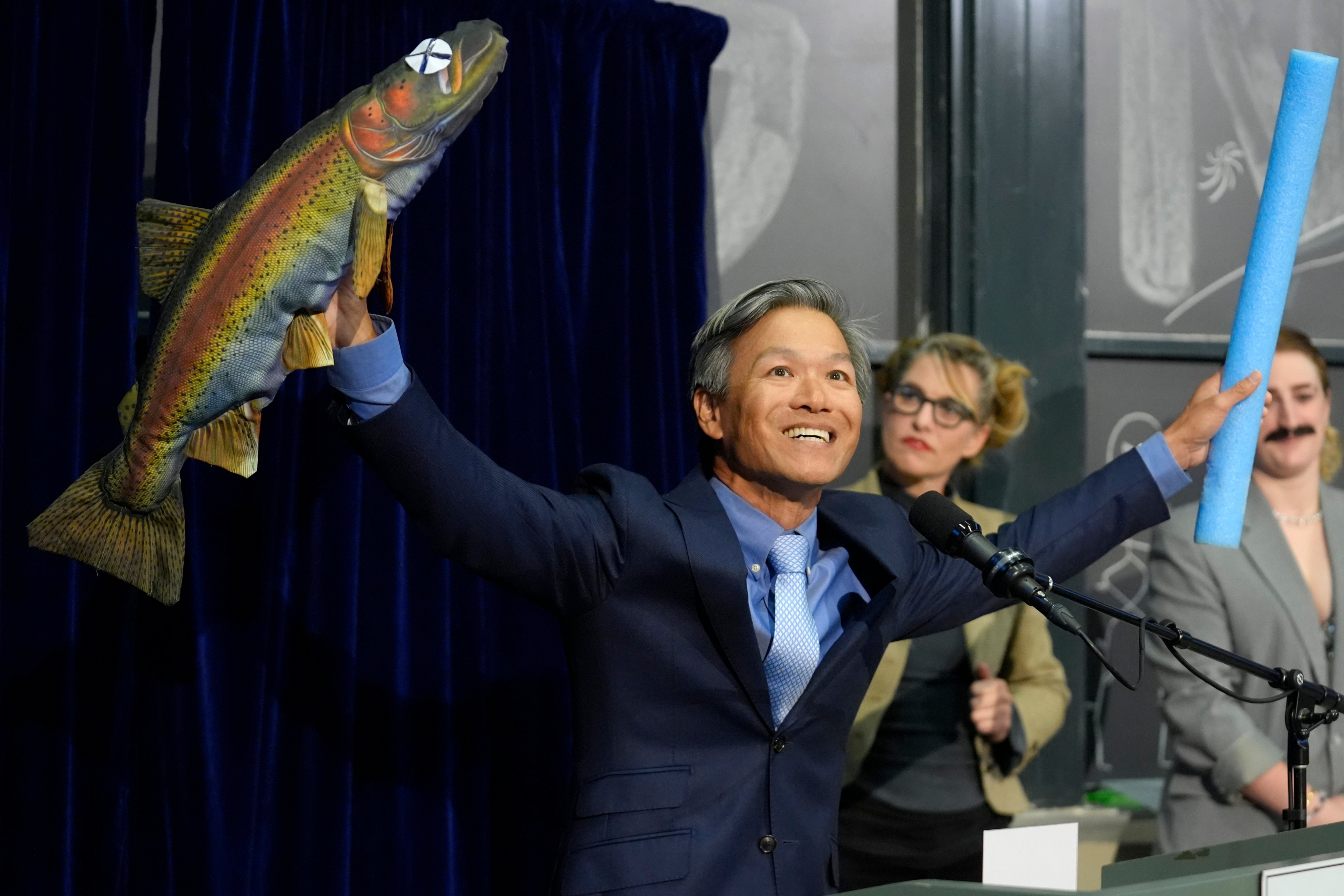 Professor James Liao accept a prize for physics for explaining the swimming abilities of a dead trout during a performance at the Ig Nobel Prize ceremony at Massachusetts Institute of Technology. Photo: AP