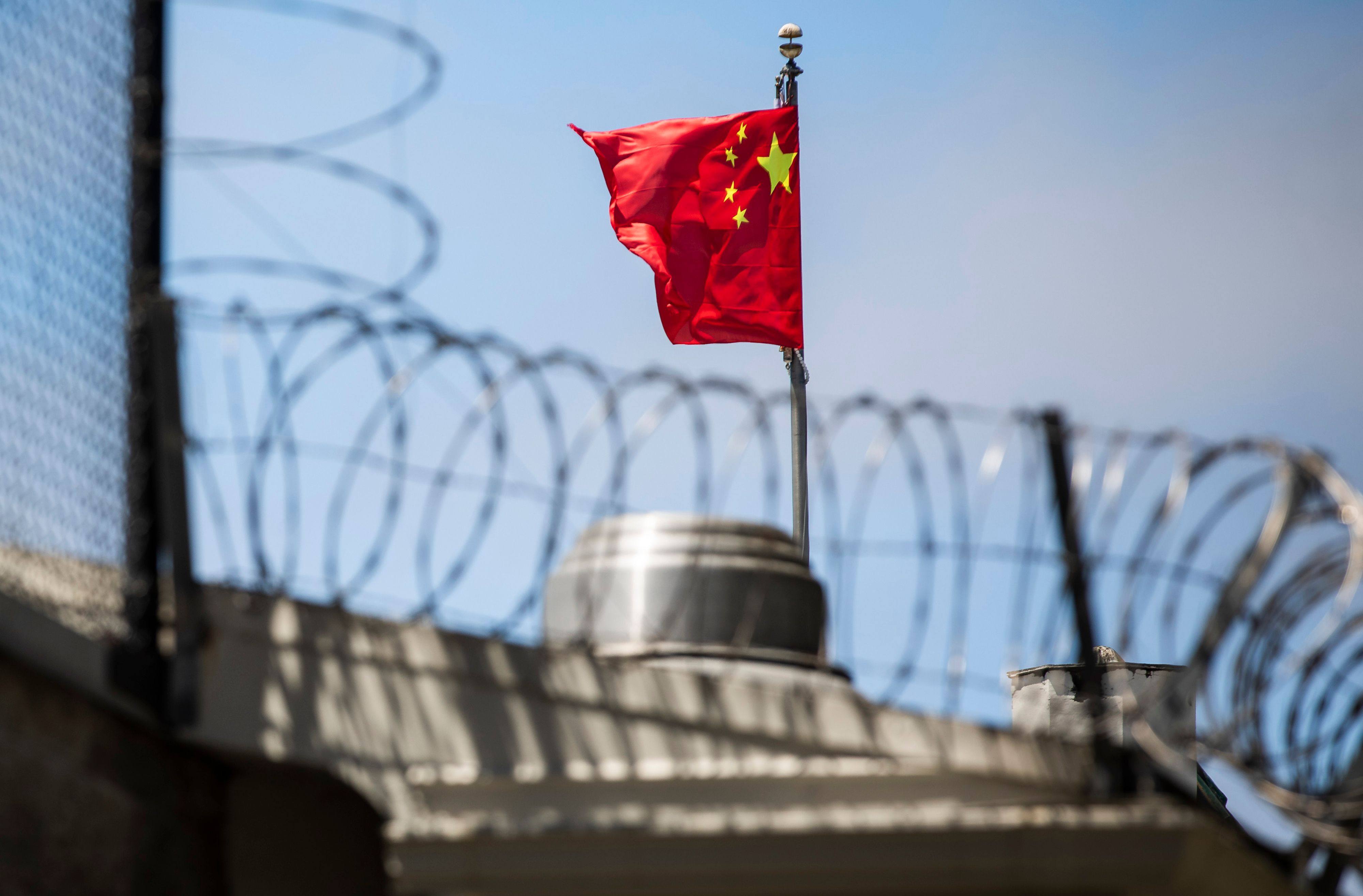 A Chinese flag flies behind barbed wire at the Chinese Consulate General in San Francisco in July 2020. Photo: AFP