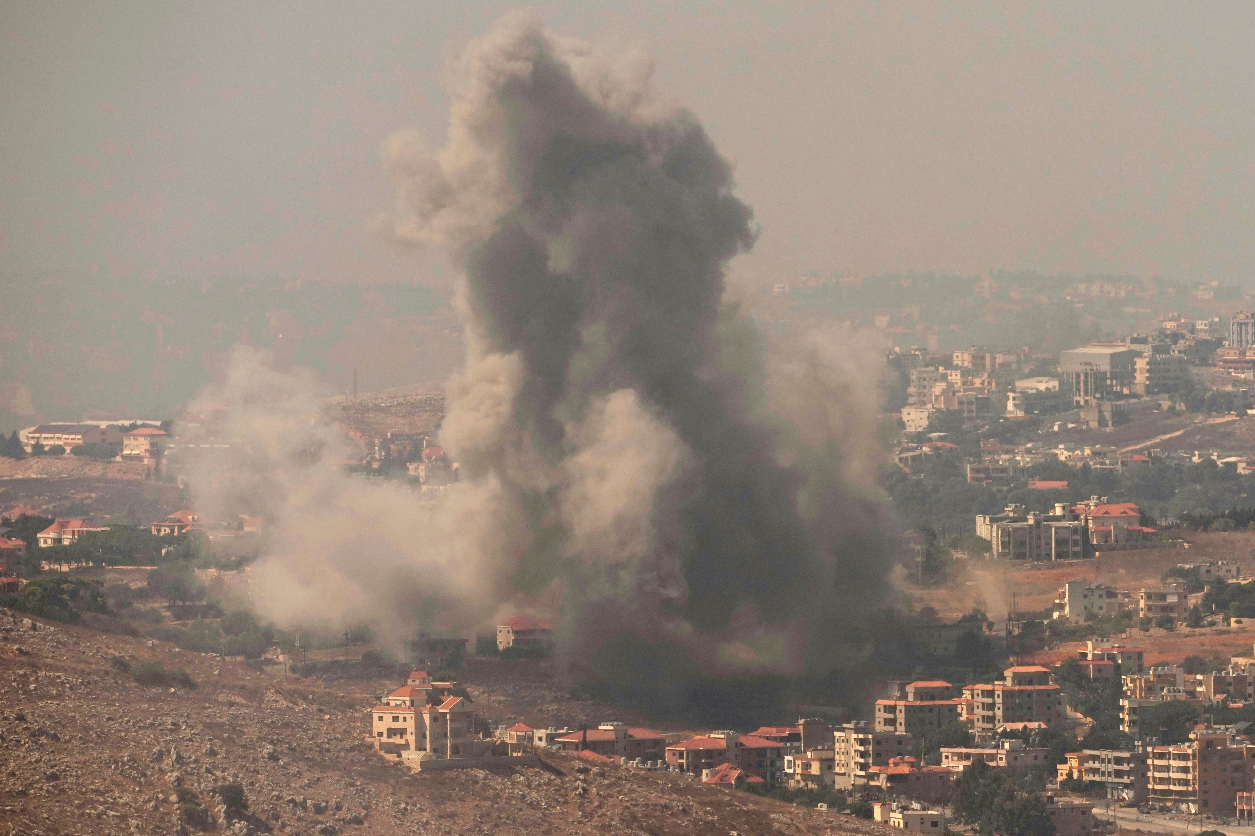 Smoke rises from Israeli airstrikes in the southern village of Kfar Rouman, seen from Marjayoun, south Lebanon, on Wednesday. Photo: AP