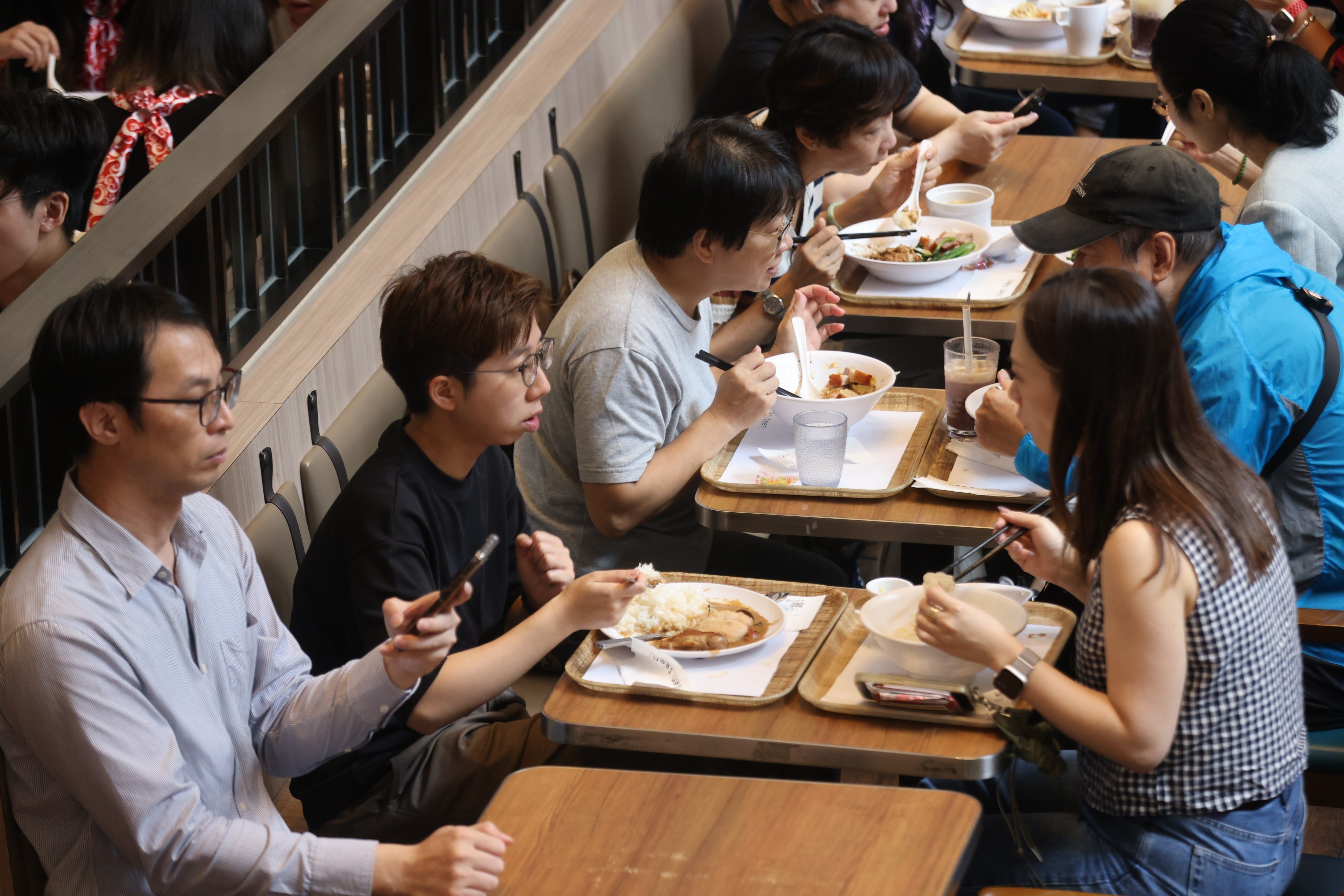 Diners at Queensway Plaza in Admiralty. Food and catering businesses will offer an array of deals to celebrate National Day. Photo: Jonathan Wong