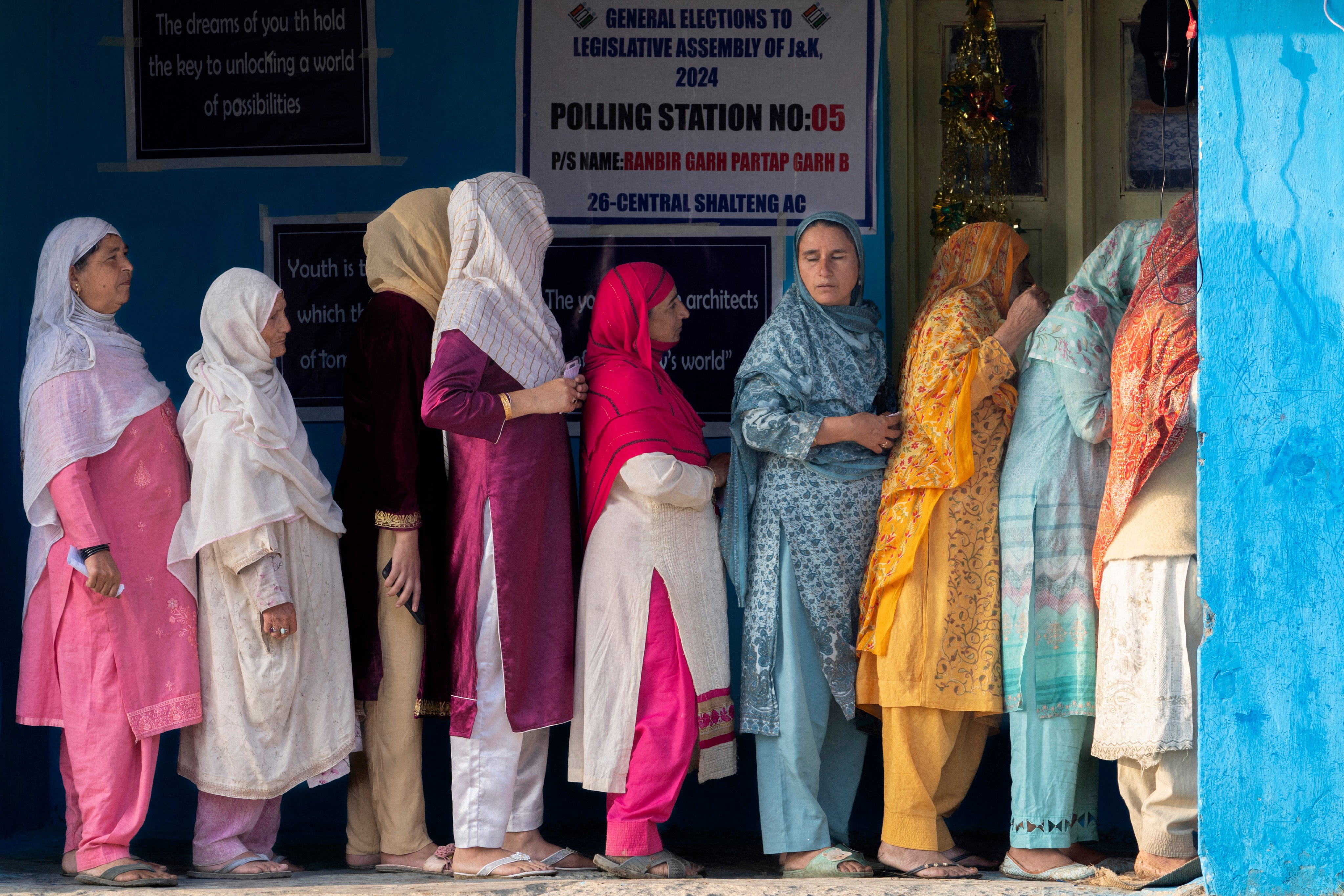 Kashmiri women queue up at a polling booth to cast their vote during the second phase of the assembly election in the outskirts of Srinagar, Indian controlled Kashmir on September 25. Photo: AP