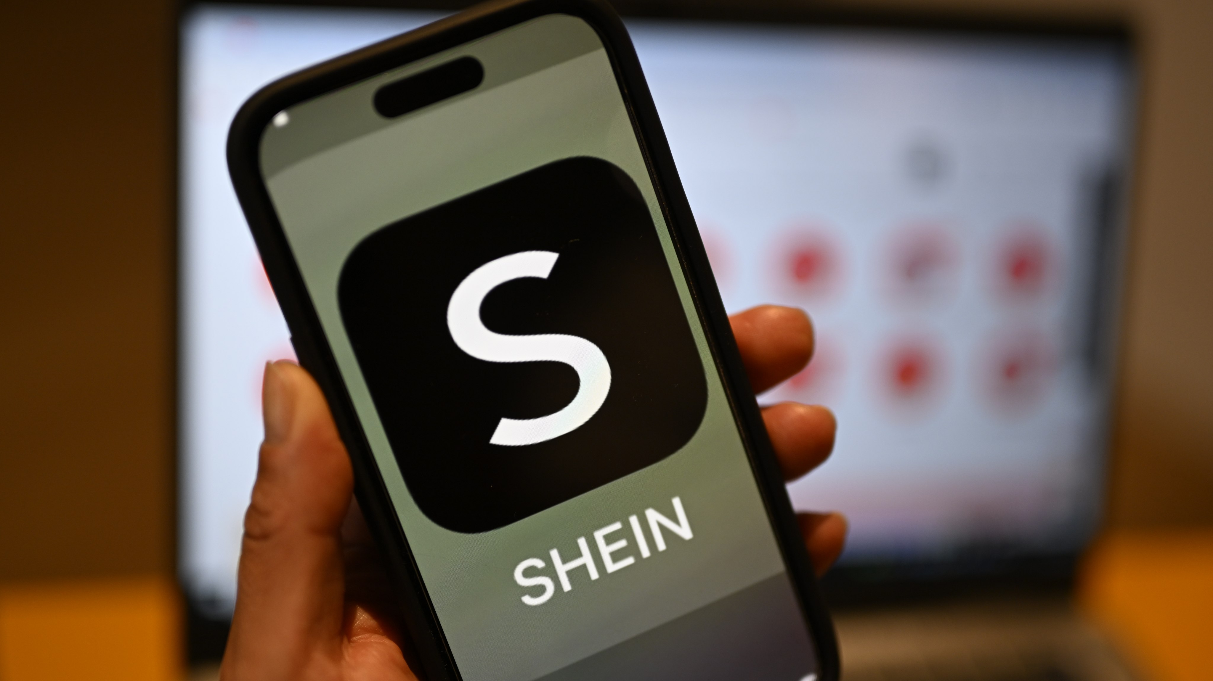 The Shein logo is displayed on a smartphone. Photo: dpa