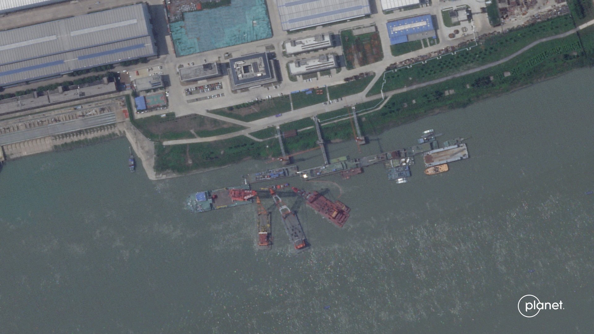 A satellite image from Planet Labs from June appear to show cranes at the Wuchang shipyard in Wuhan Shi, China on June 15. Photo: Planet Labs Inc / Handout via Reuters