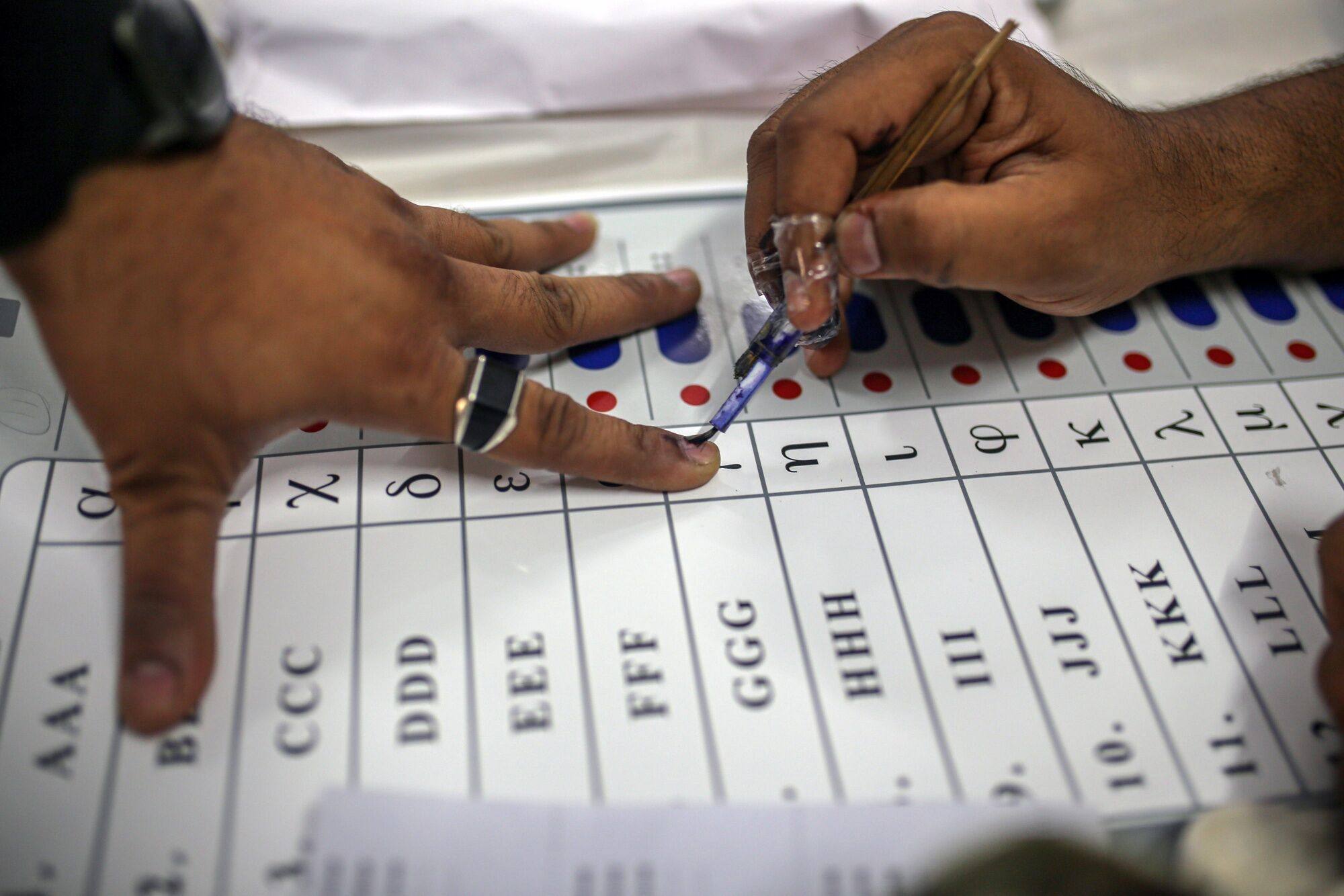 A voter’s finger is marked with indelible ink after casting a ballot during the third phase of voting for national elections in Ahmedabad, Gujarat, India, on May 7. Photo: Bloomberg