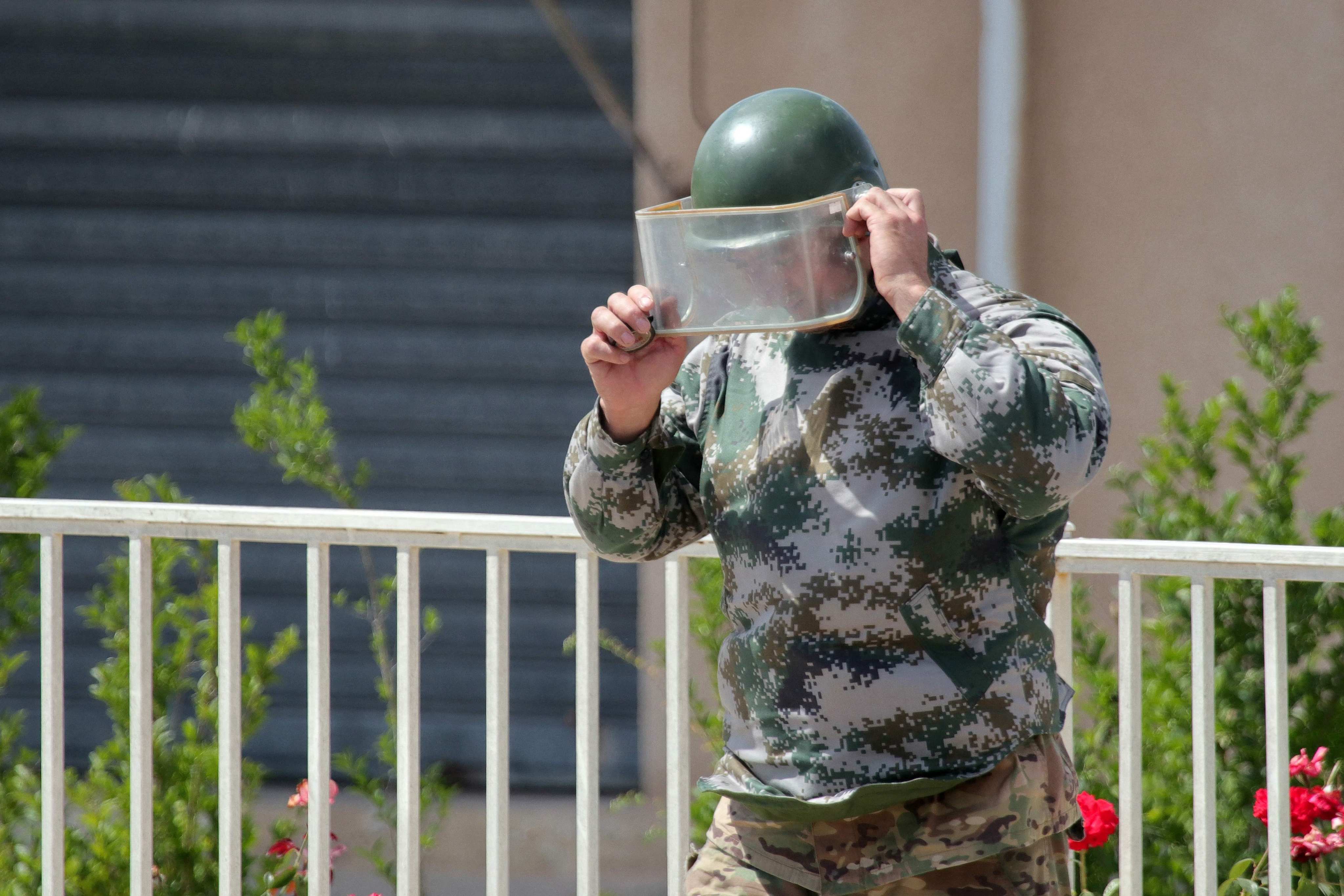 A member of the Lebanese army prepares to destroy a communication device found on the ground in southern Lebanon last week. Photo: AFP