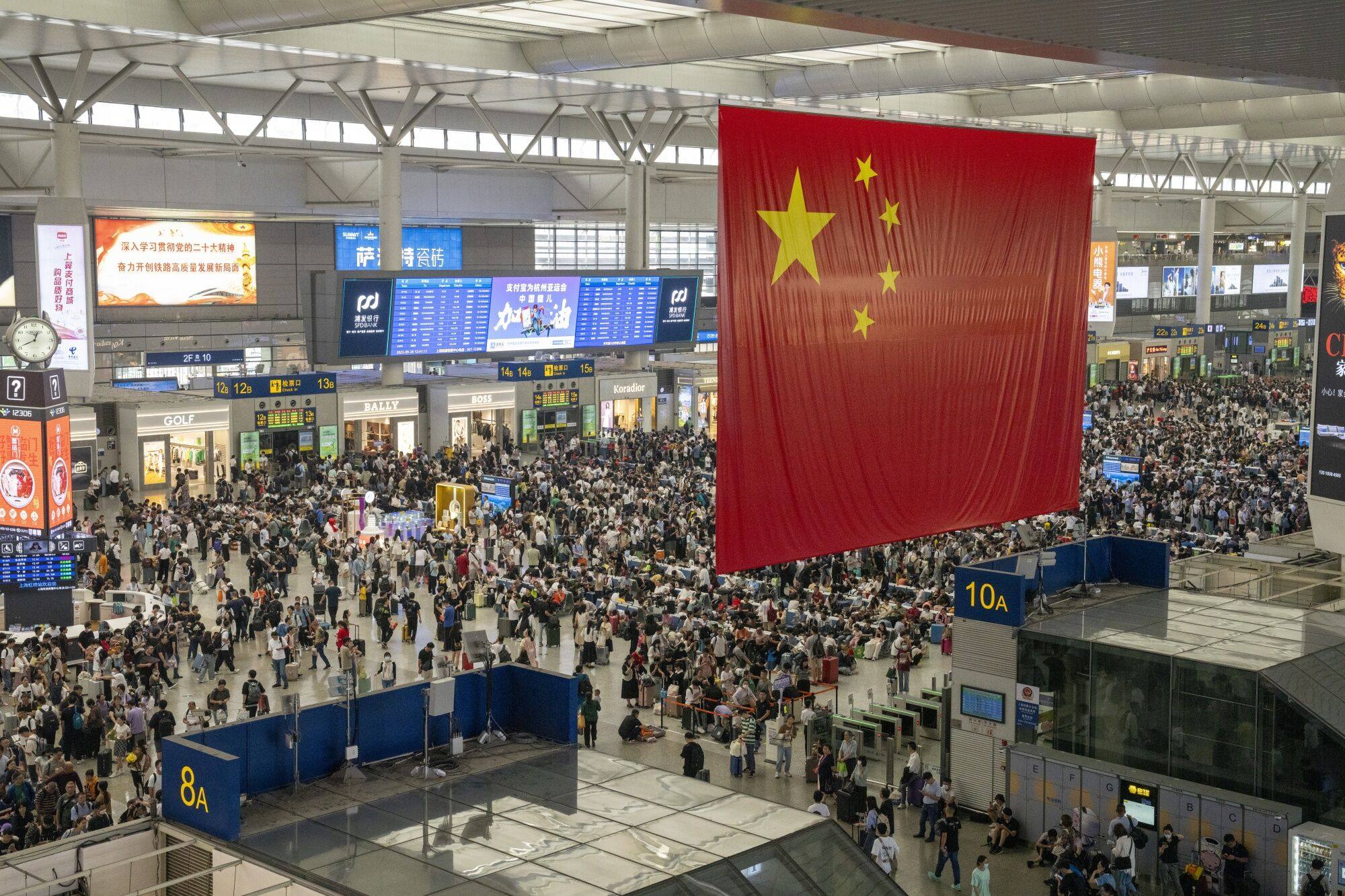 Travelers at Hongqiao Railway Station in Shanghai in September 2023. Photo: Bloomberg